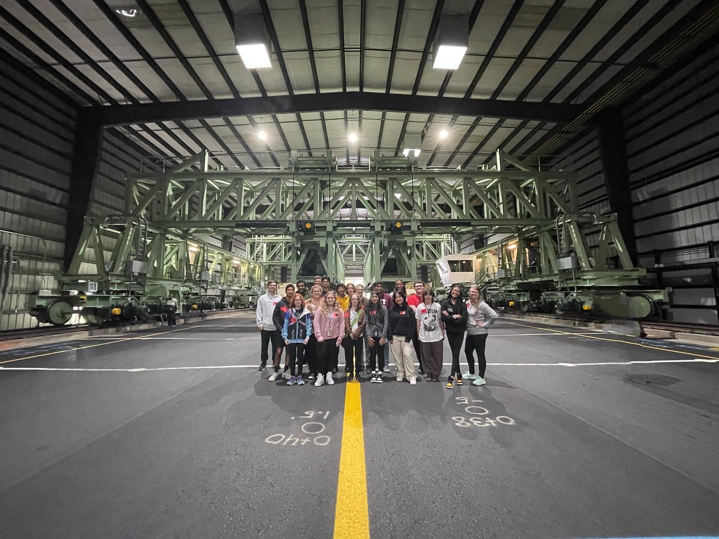 students standing in pavement facility 