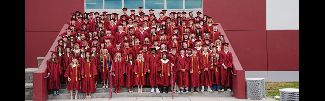 Photo of the graduating class of 2026 on the front steps of the hamilton high school