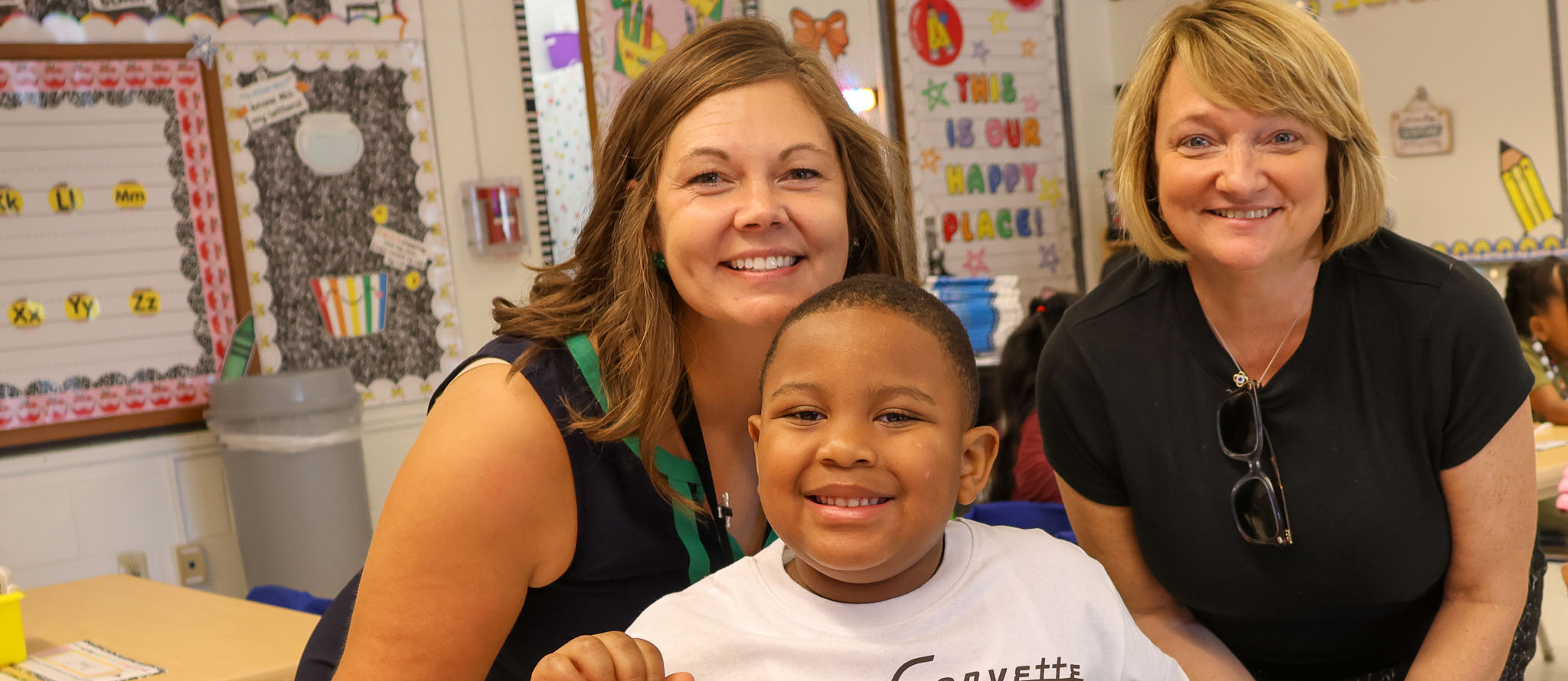 student and principal with superintendent 