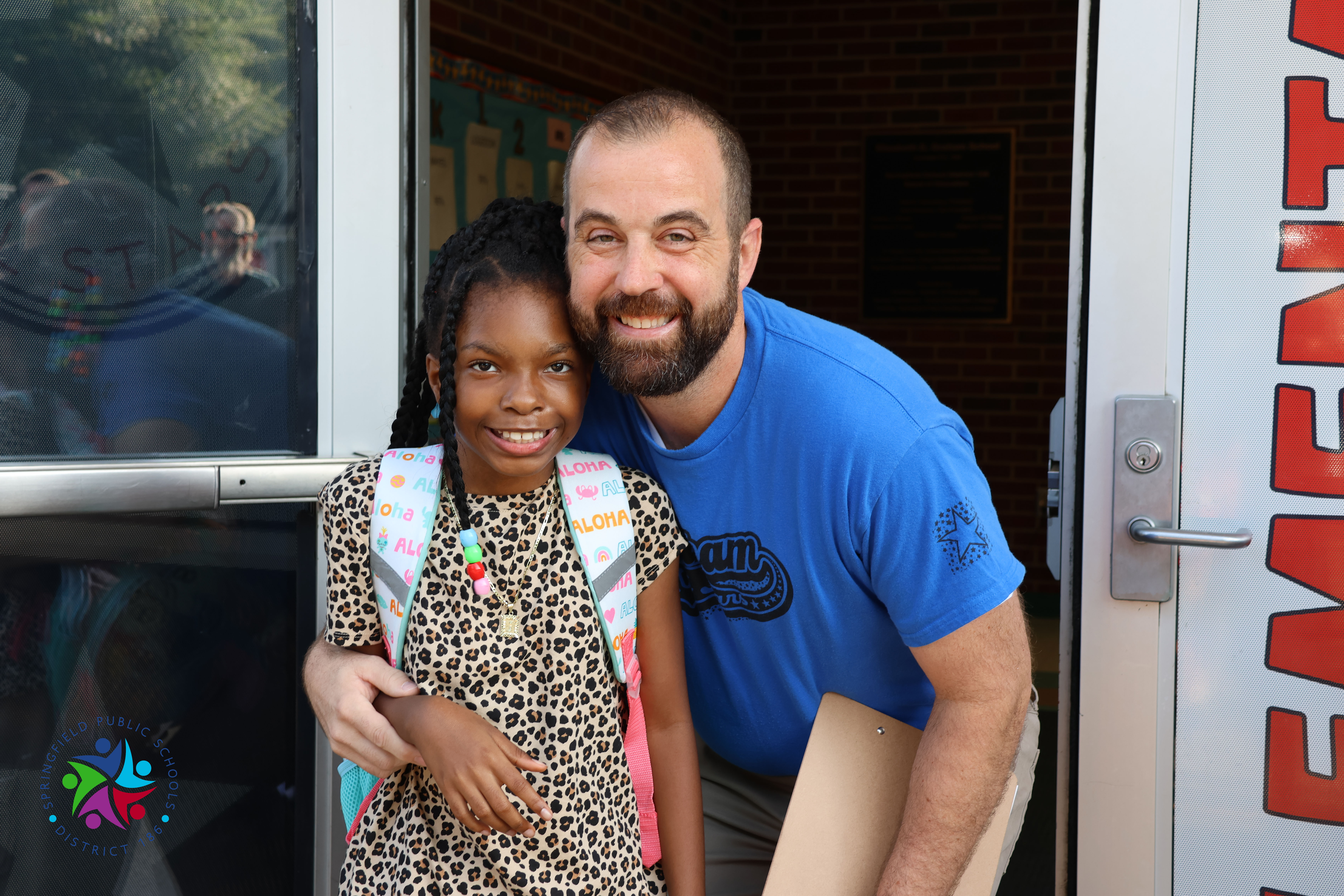 principal hood and student 