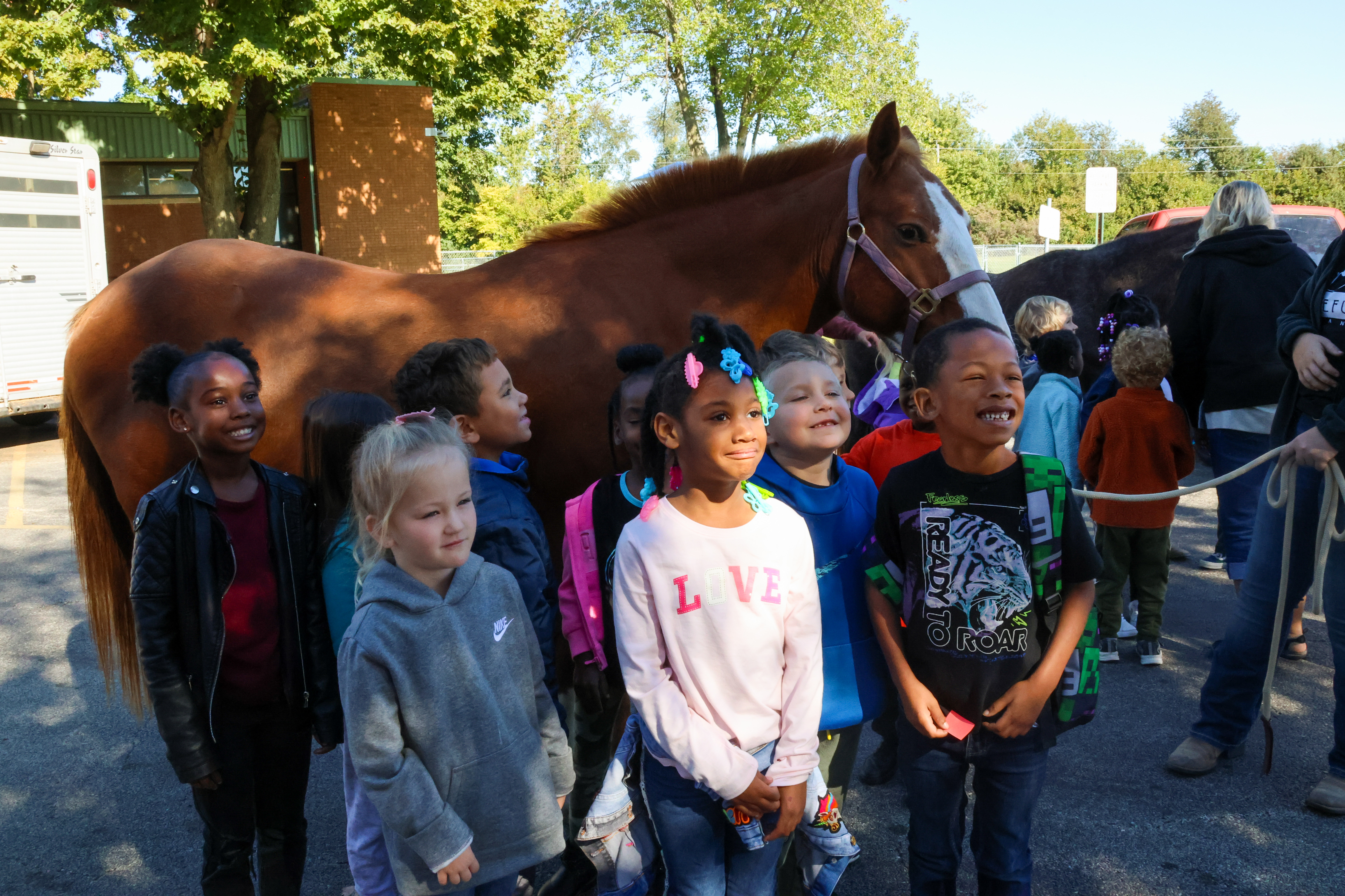lee students smiling by horse