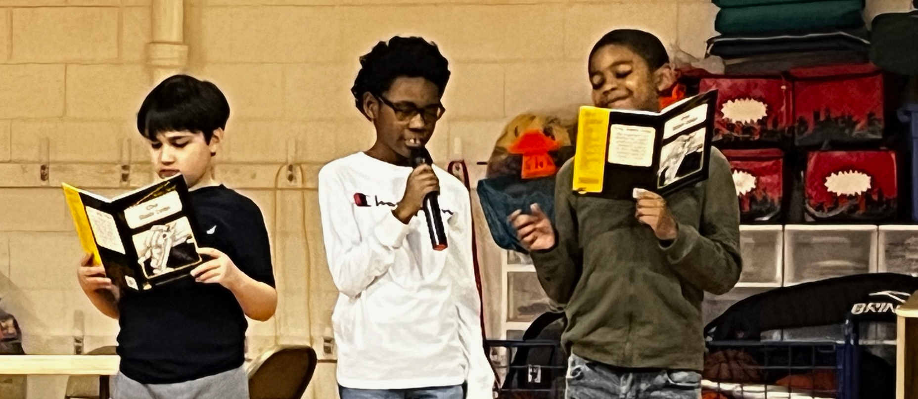 Three boys reading books