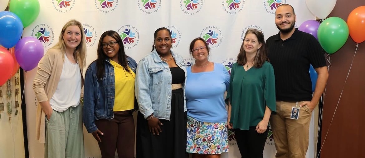 Picture of 5 new staff members standing together