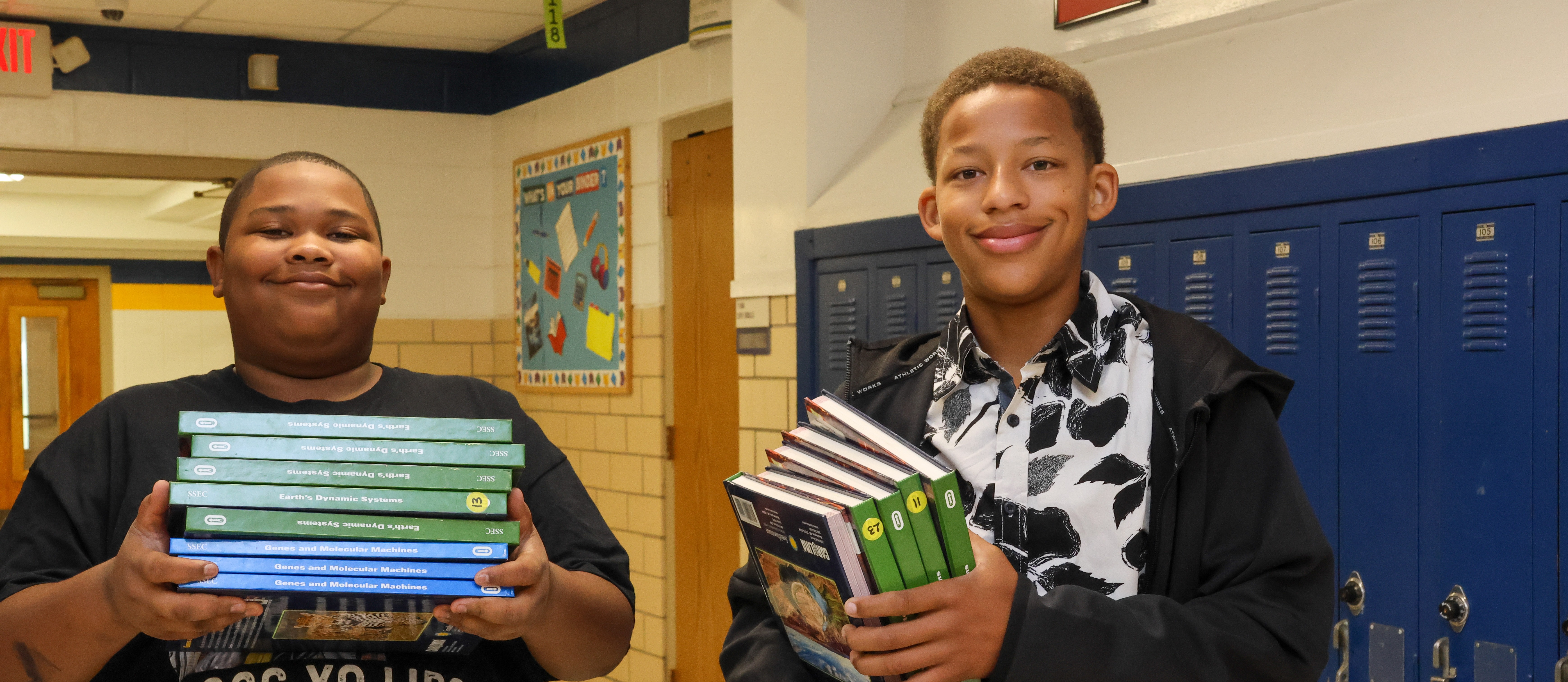 students helping carry books 