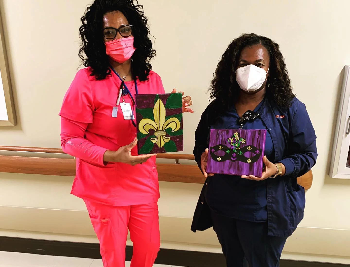 Two women holding a picture