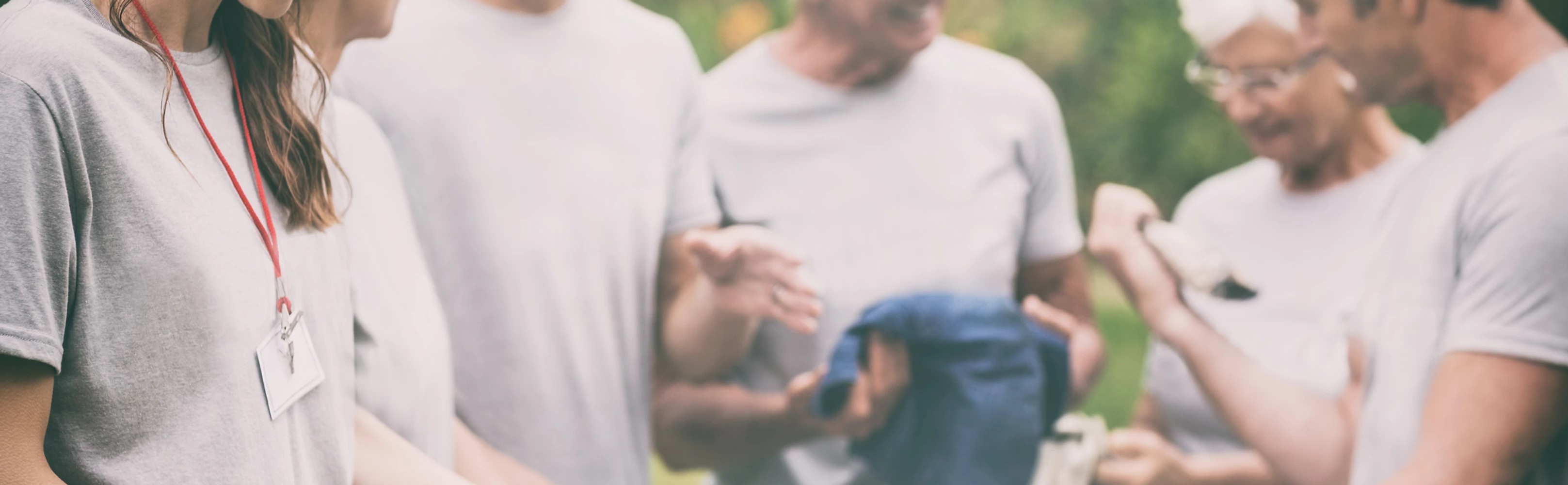 A group of people in gray T shirts