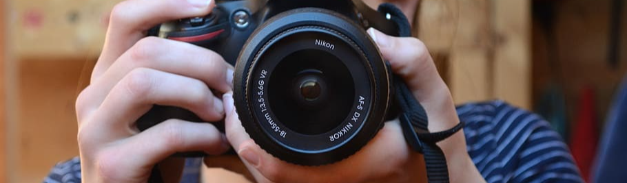 Girl taking a picture with camera
