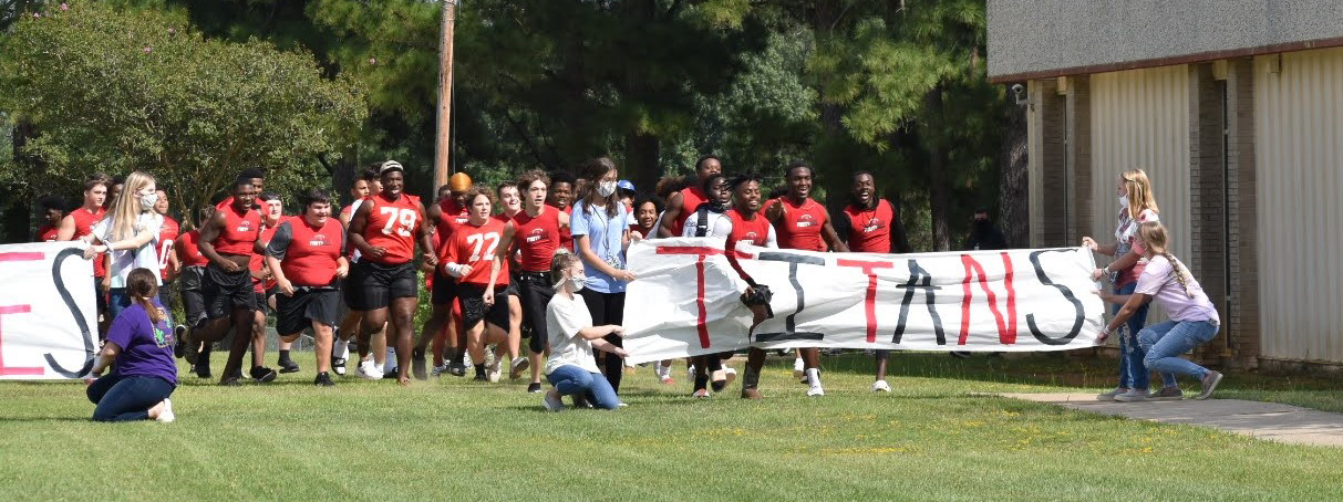 Football team running onto the field