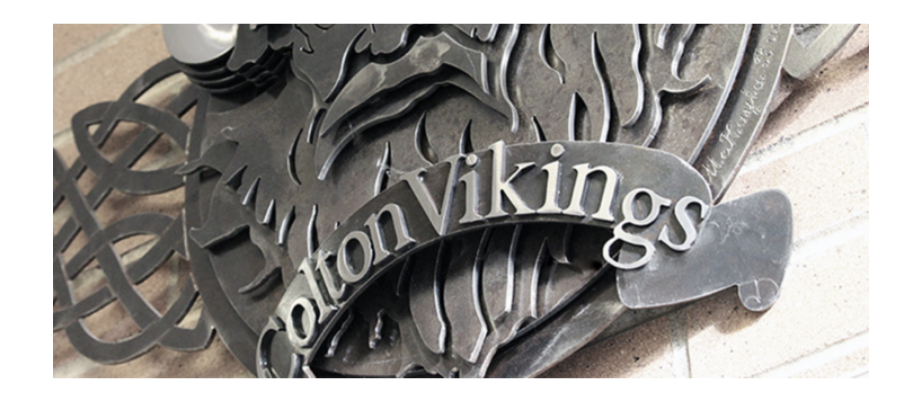 Colton Vikings crest handing on wall.