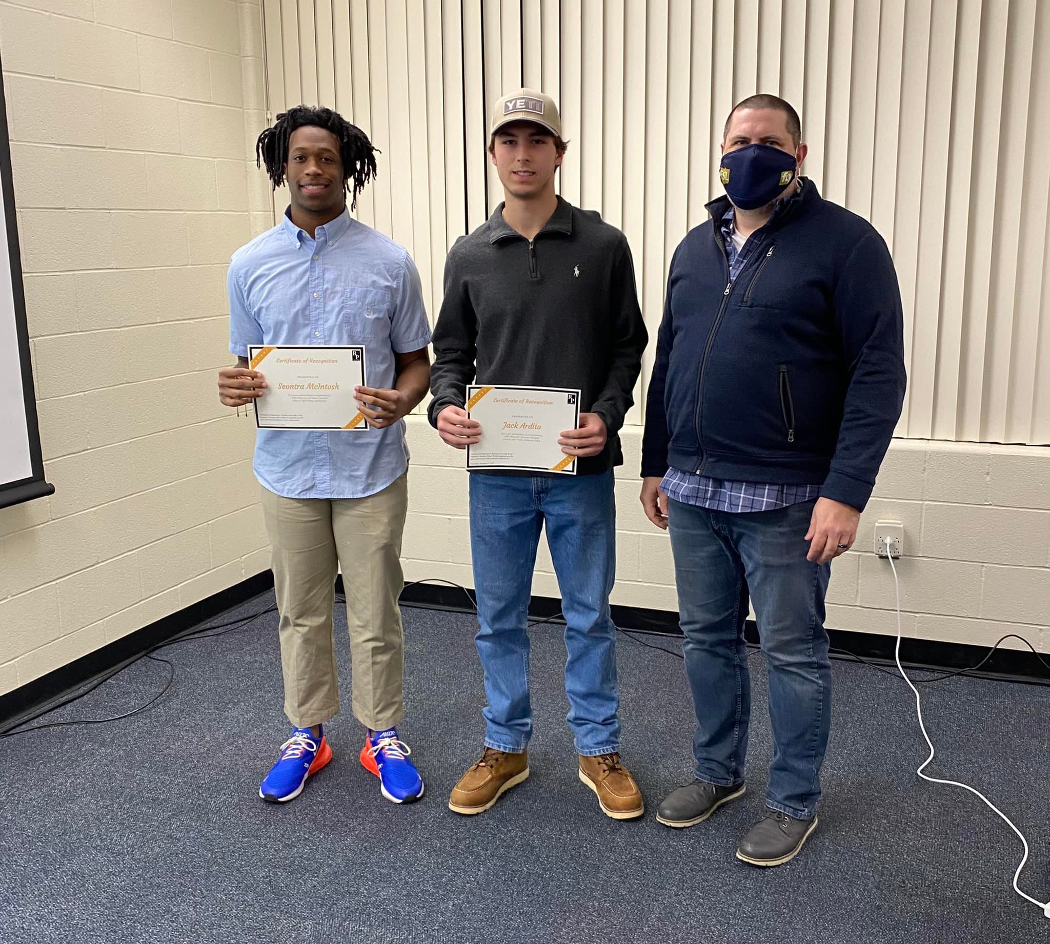 Board honors All-State football players