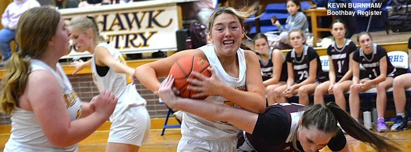 Seahawk center Tatum French takes the ball away from a Monmouth player during the second half of Wednesday's game at BRHS. 