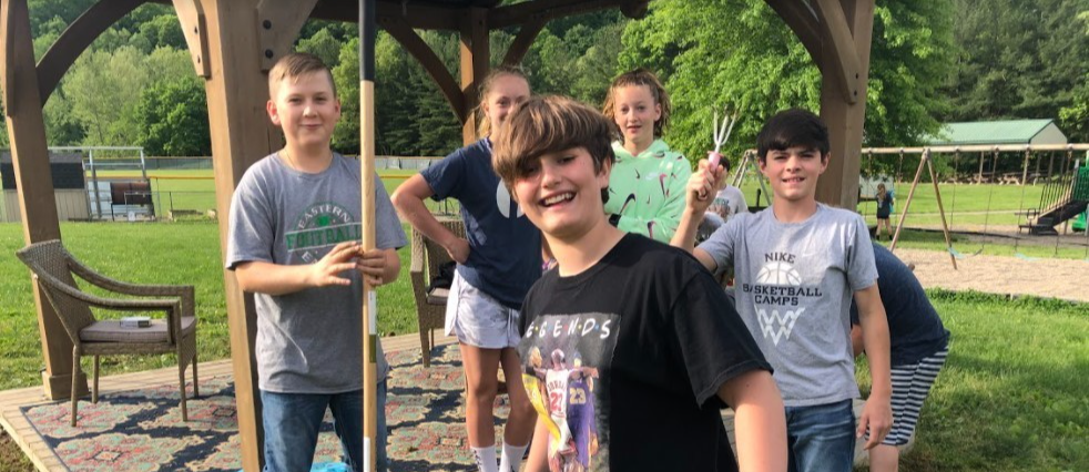 5 students working outside gardening