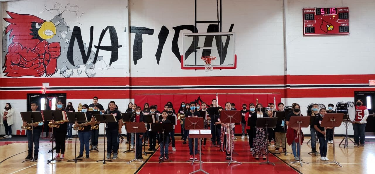 middle school students at attention in gym