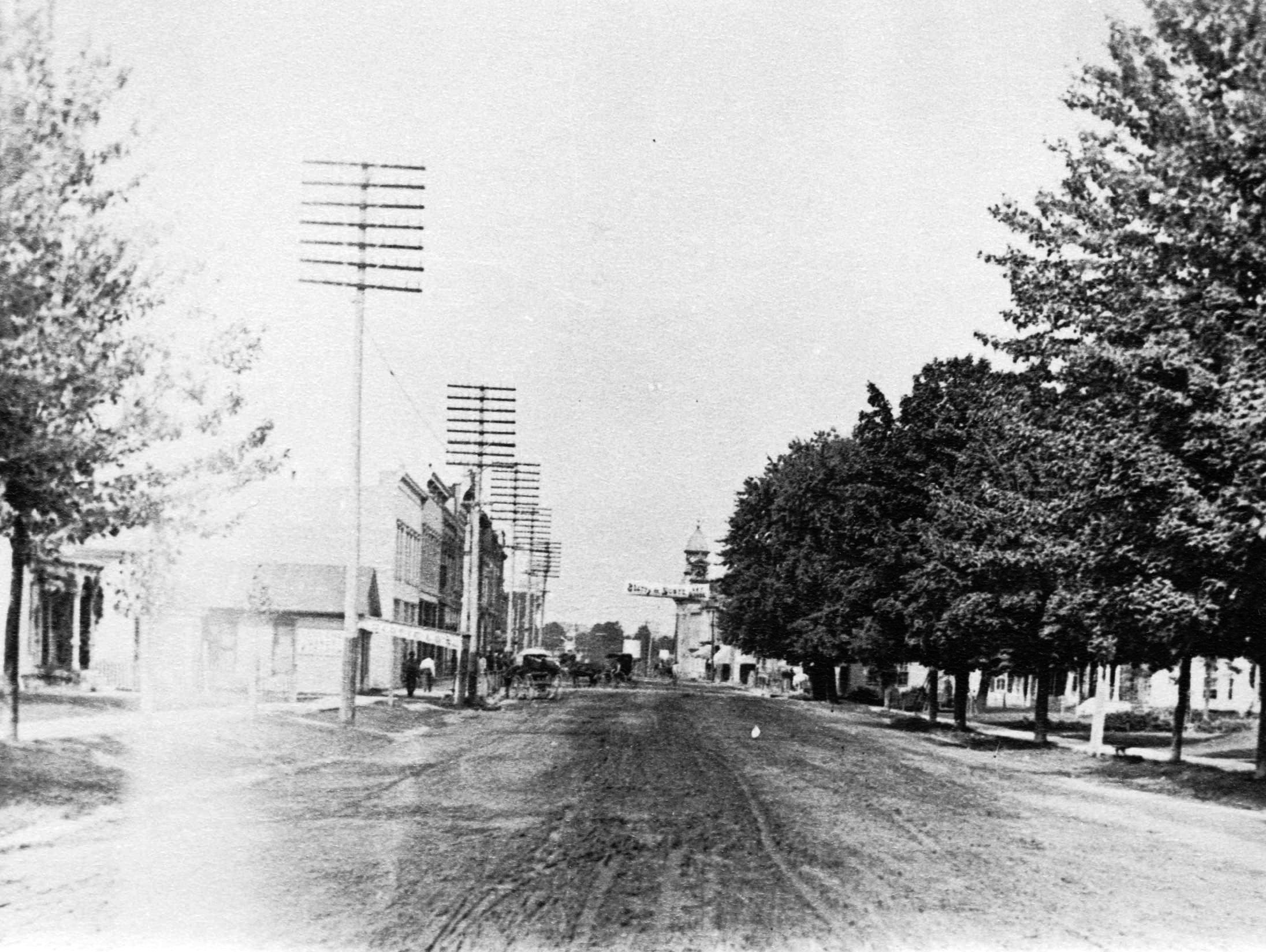 W. Main Street, Morenci, Michigan.  Looking west from Sponsler’s or Stephenson’s prior to 1911.  Mace house on north side of street.  (1898)