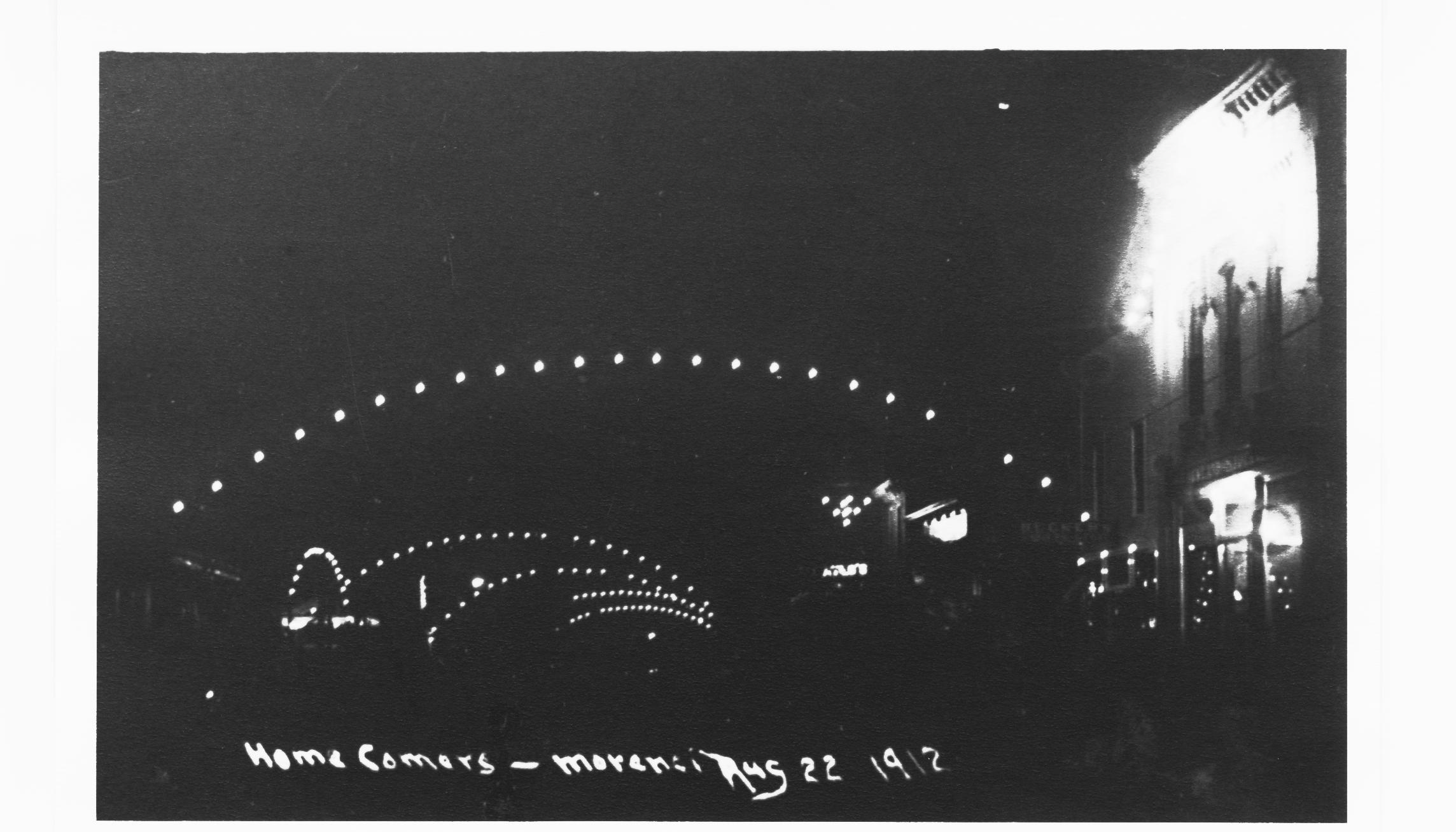 Homecomers’ celebration, 1912, Morenci, Michigan.  Taken at night.  Probably first night photo of a street fair.