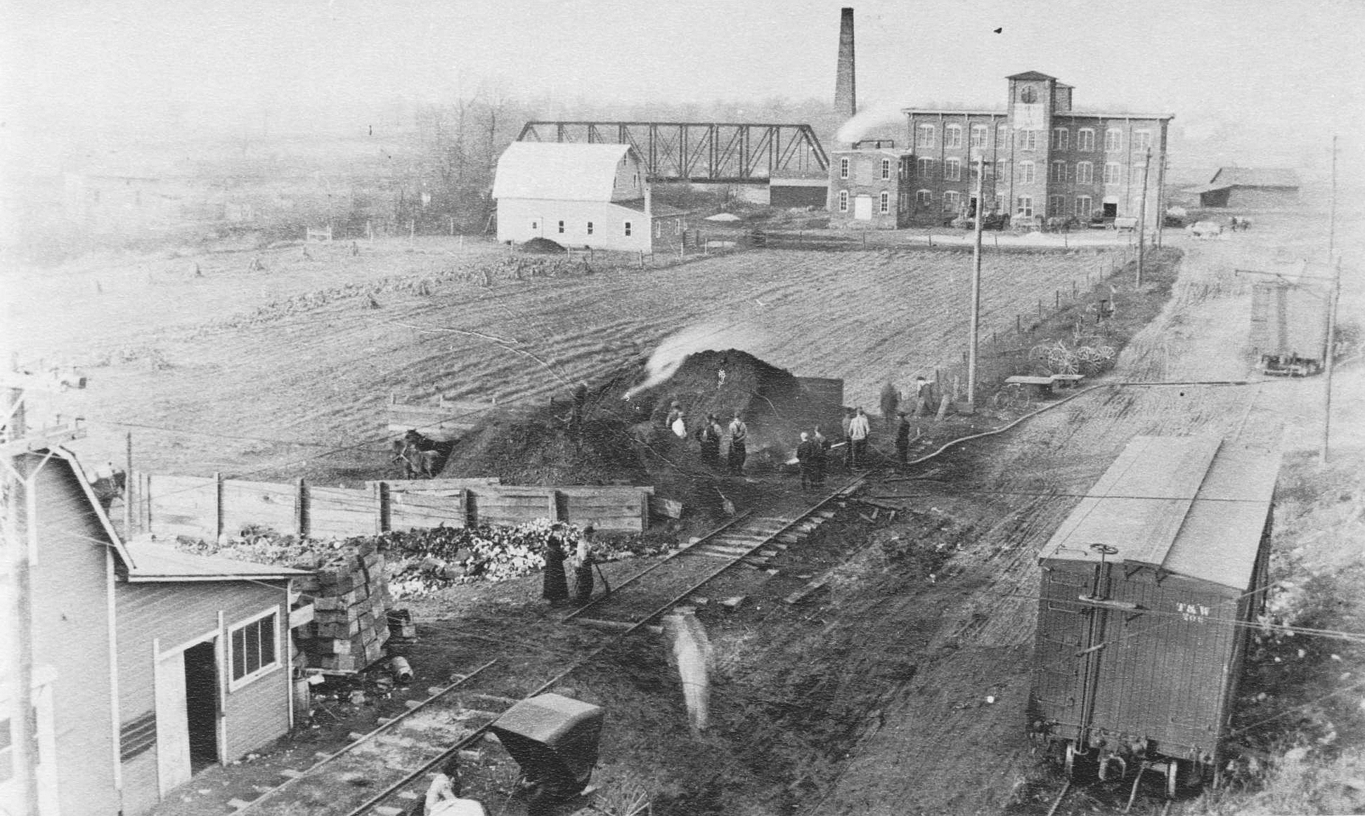 Mill Street, Morenci, Michigan – after 1908, looking north from Porter’s barn.  Kellogg & Buck in distance.  New barn built after 1916 fire there.  