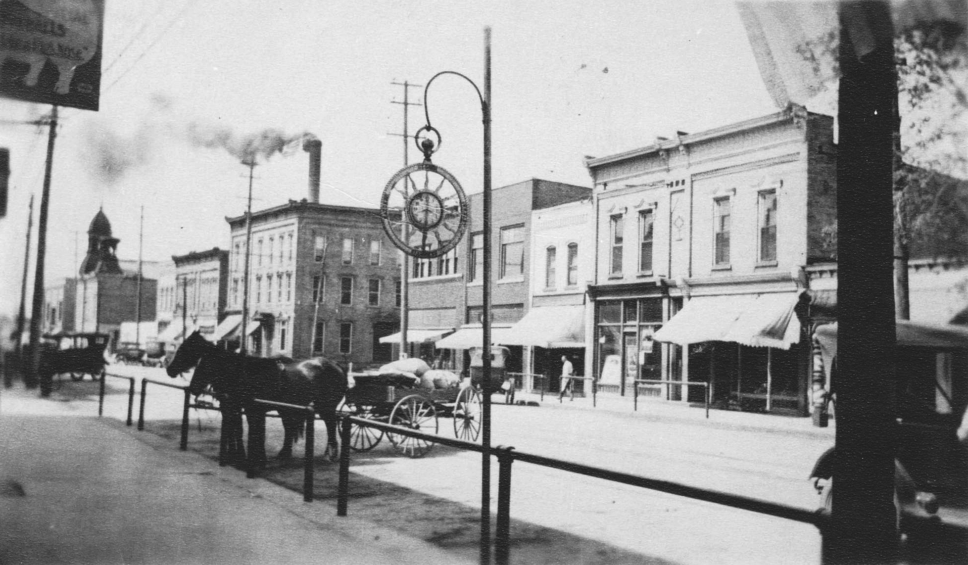 Main Street, north side, looking west.  Taken from Stephenson’s Jewelry store location.  (Shea Tax office building)