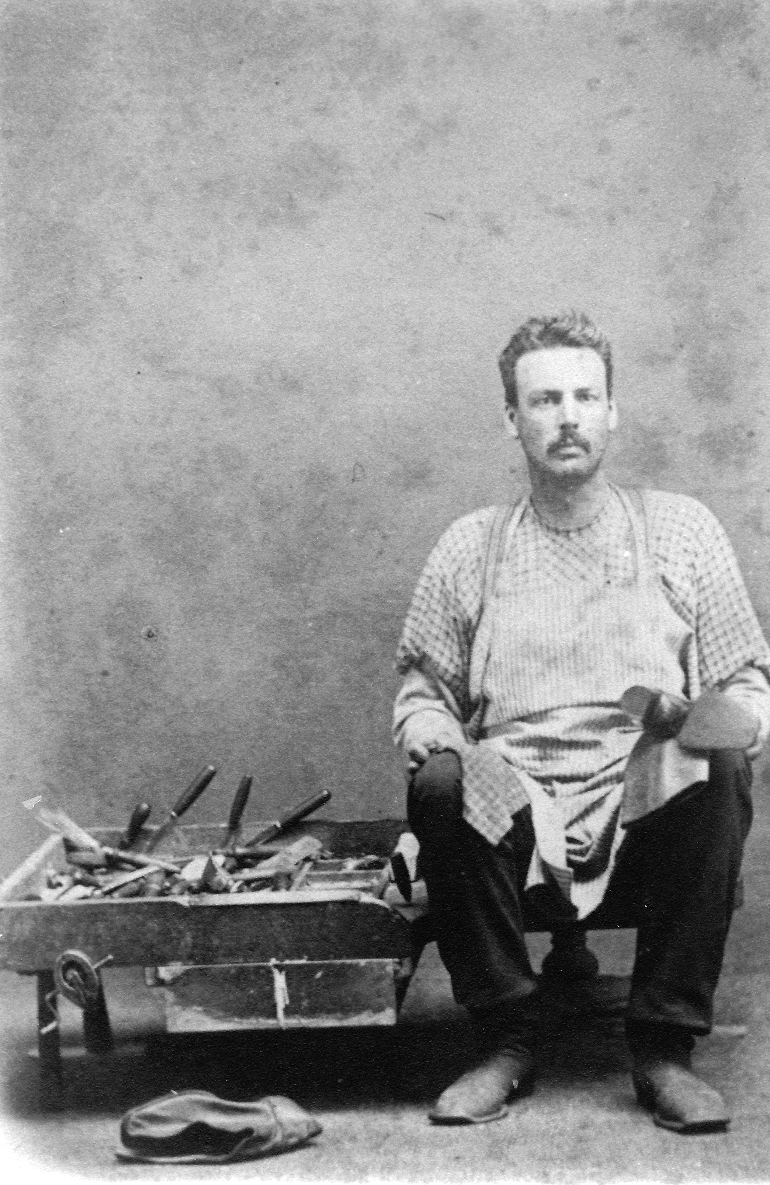 Charles Chase, the shoe cobbler.  Father of the late Maude Chase, Morenci historian.