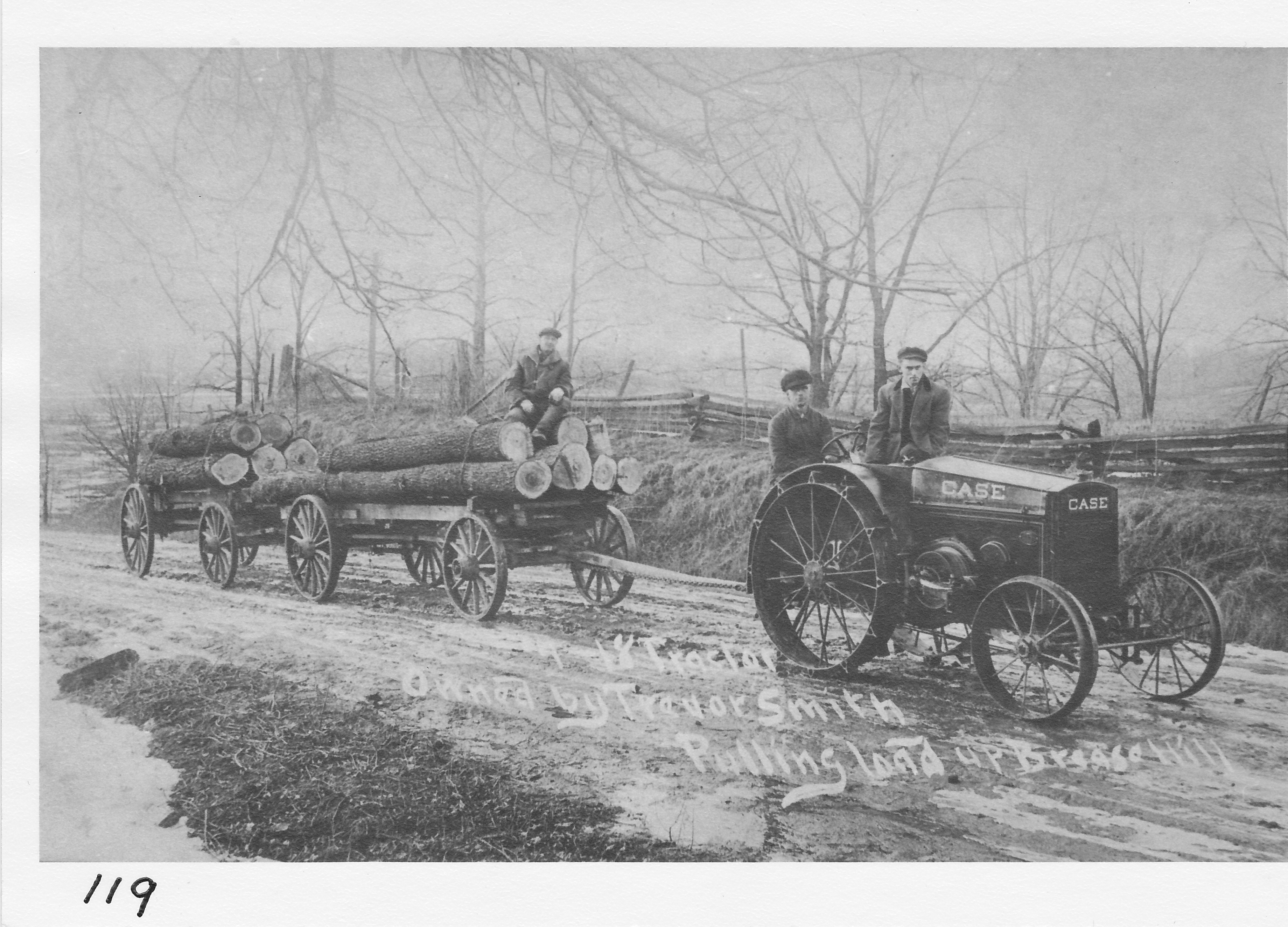 Tractor pulling logs.  Trevor Smith with his tractor.