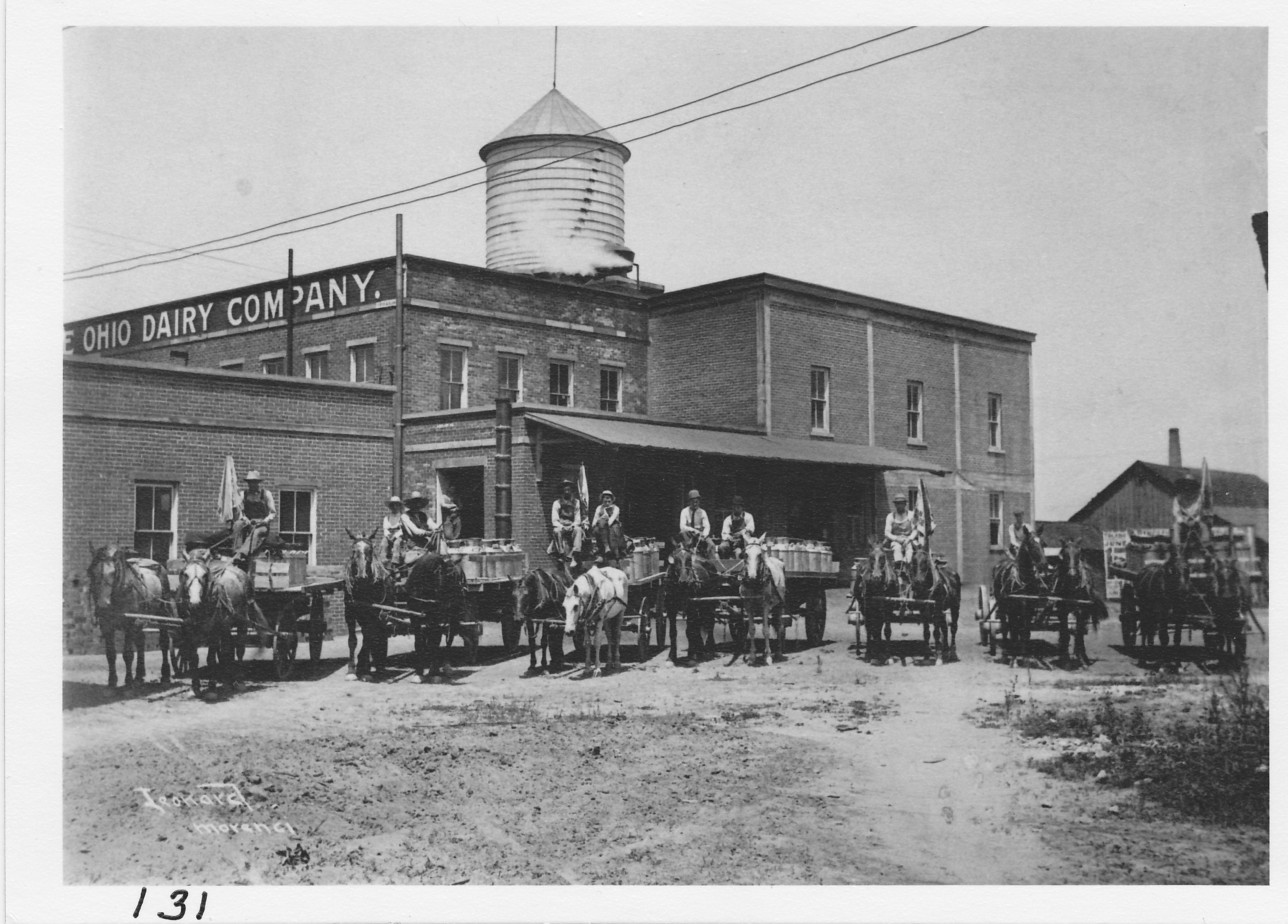 Ohio Dairy Company, east side view off Locust Street with milk hauling teams.