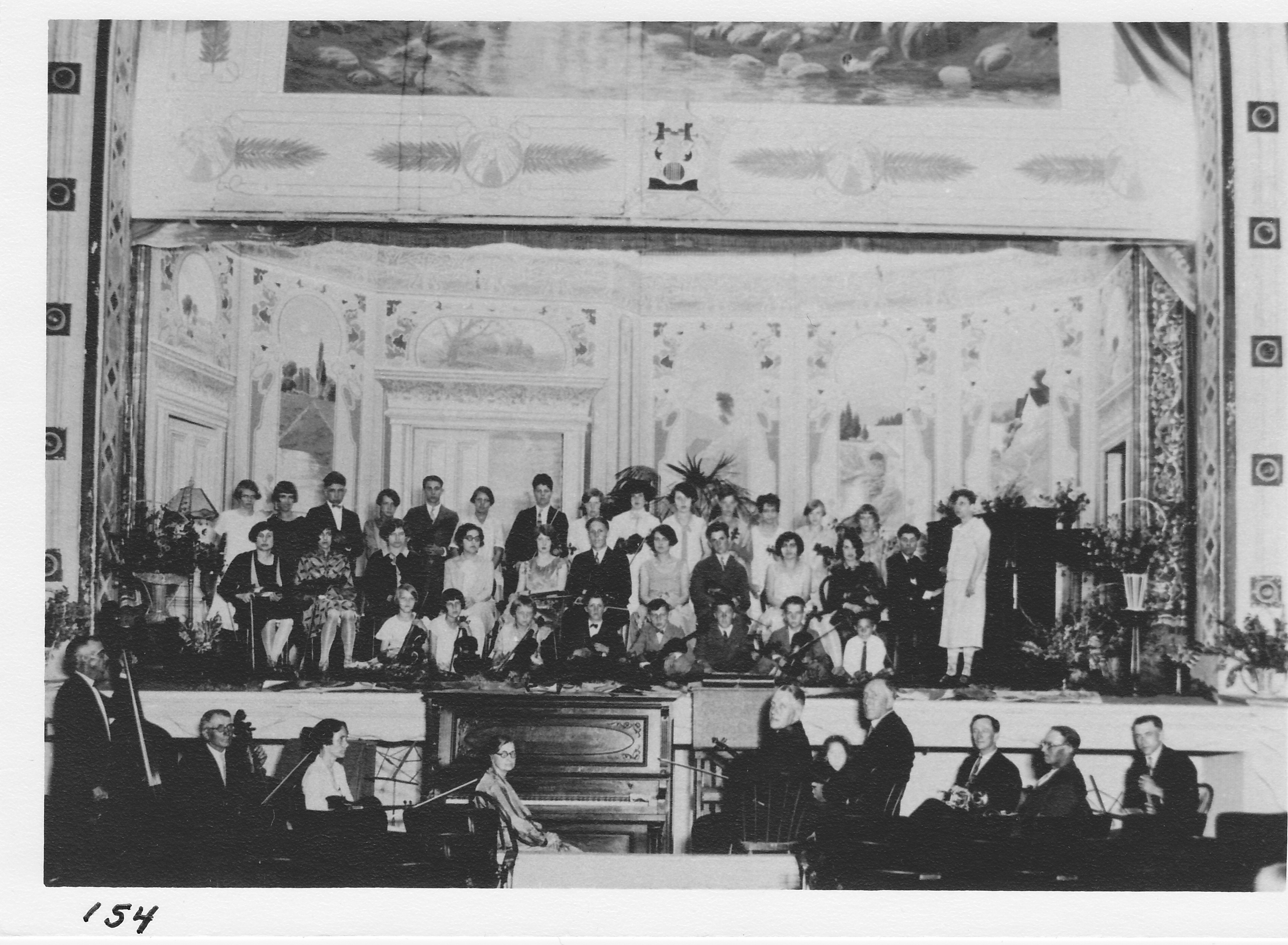 Recital in Stair Auditorium by pupils of Mr. Bryan.  Harry Allen’s Orchestra in pit.  Orchestra member known: extreme left – Frank Brower, 3rd from left – Dawn Beatty Kast, 3rd from right – Harve Siegfried, at piano – Lulu Starkweather. 