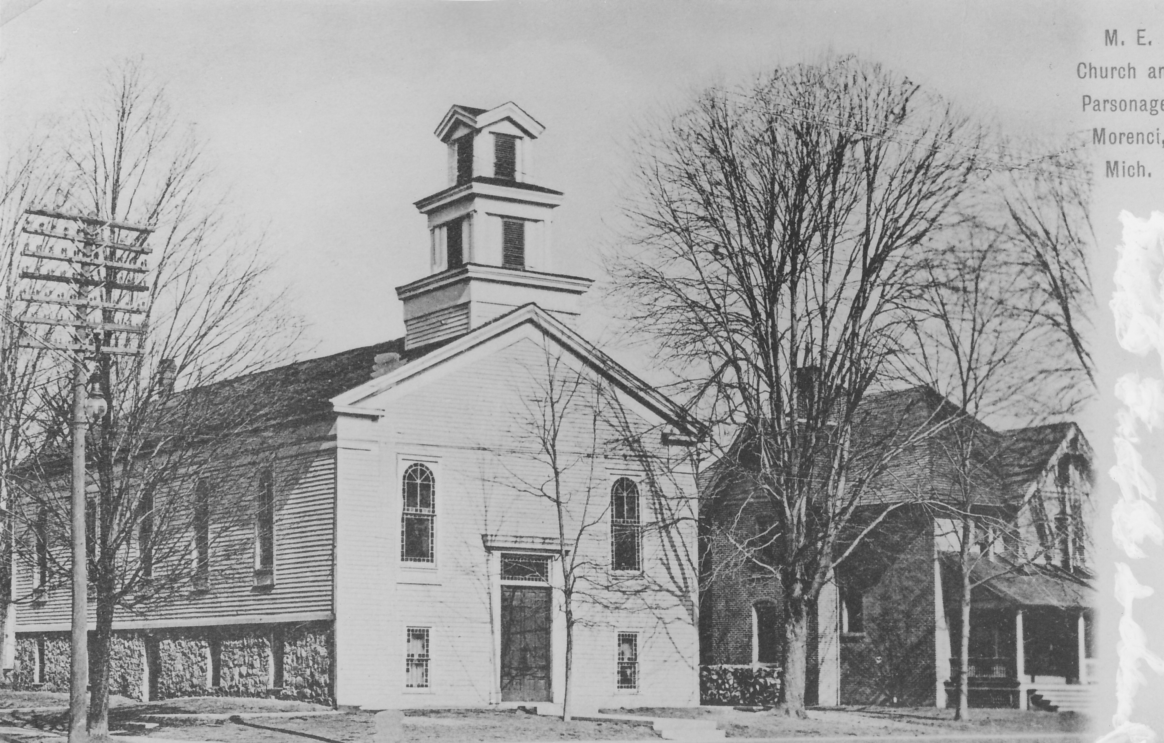Early Methodist Episcopal Church and parsonage taken between 1908 and 1914.  Church erected in 1852, parsonage built in 1902.