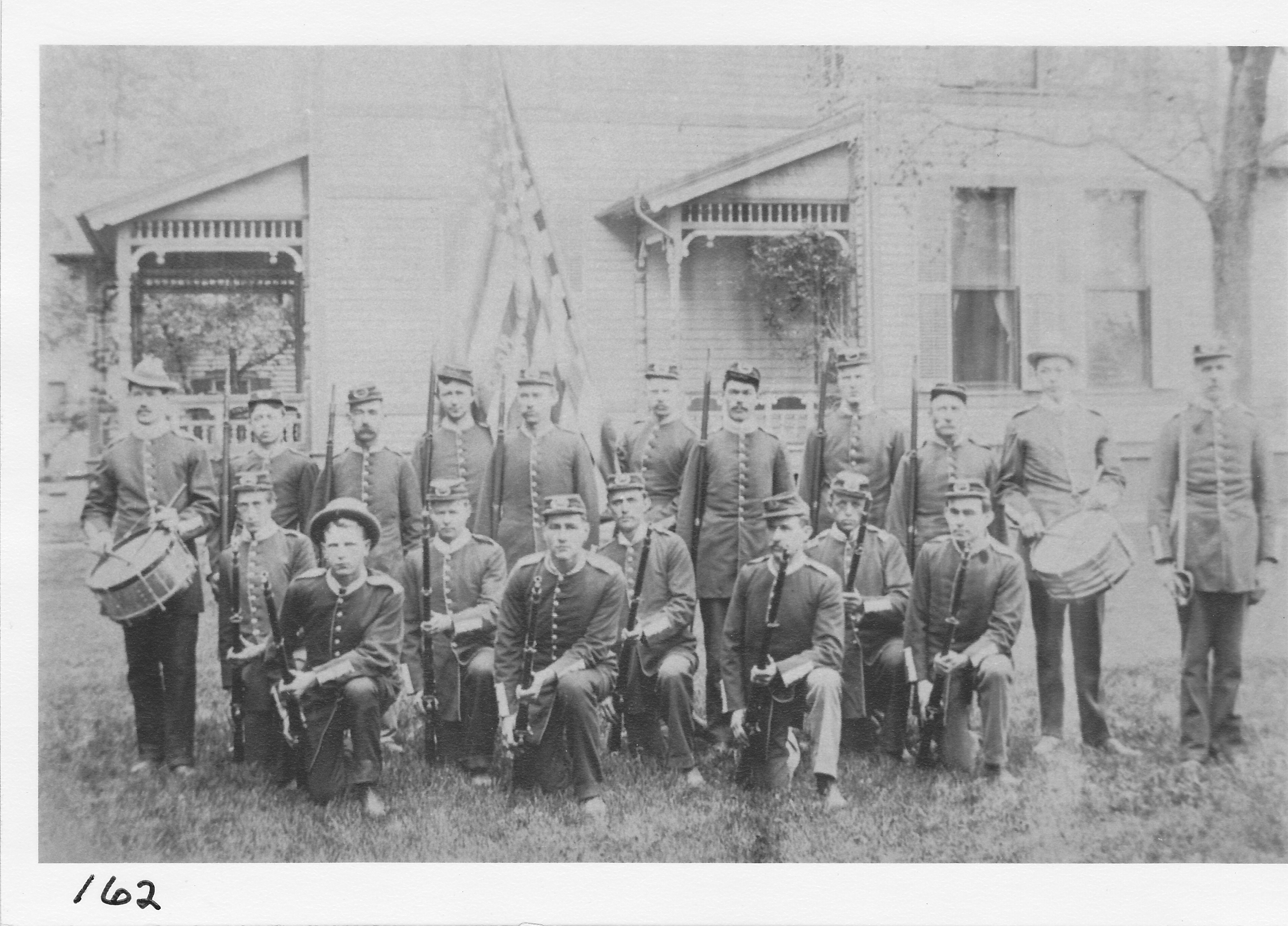 Sons of Veterans.  Picture taken in yard of W.W. Crabbs’ residence, 120 N. Summit St., just north of the Methodist Episcopal Church.