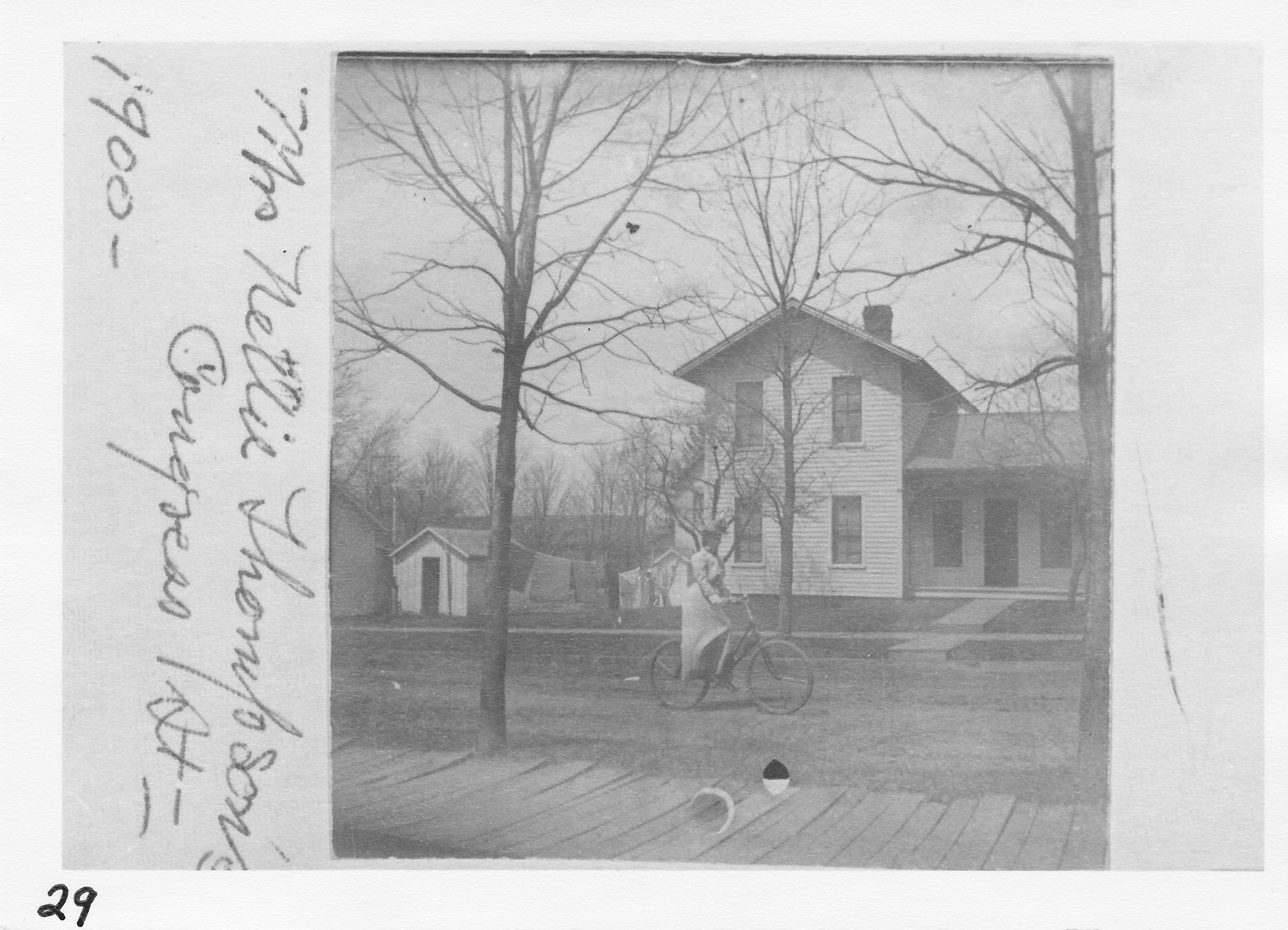 Layton-Thompson house at 132 W. Congress Street.  Built in 1872 by great-grandparents to the Reppert Brothers.  The Laytons celebrated their fiftieth wedding anniversary here.  D. S. Williams’ Lumber Yard in rear, also corner of Berry house in center rear.  Woodshed and rear of Juna Chase house at left.  One of the Murfitt girls on bicycle.