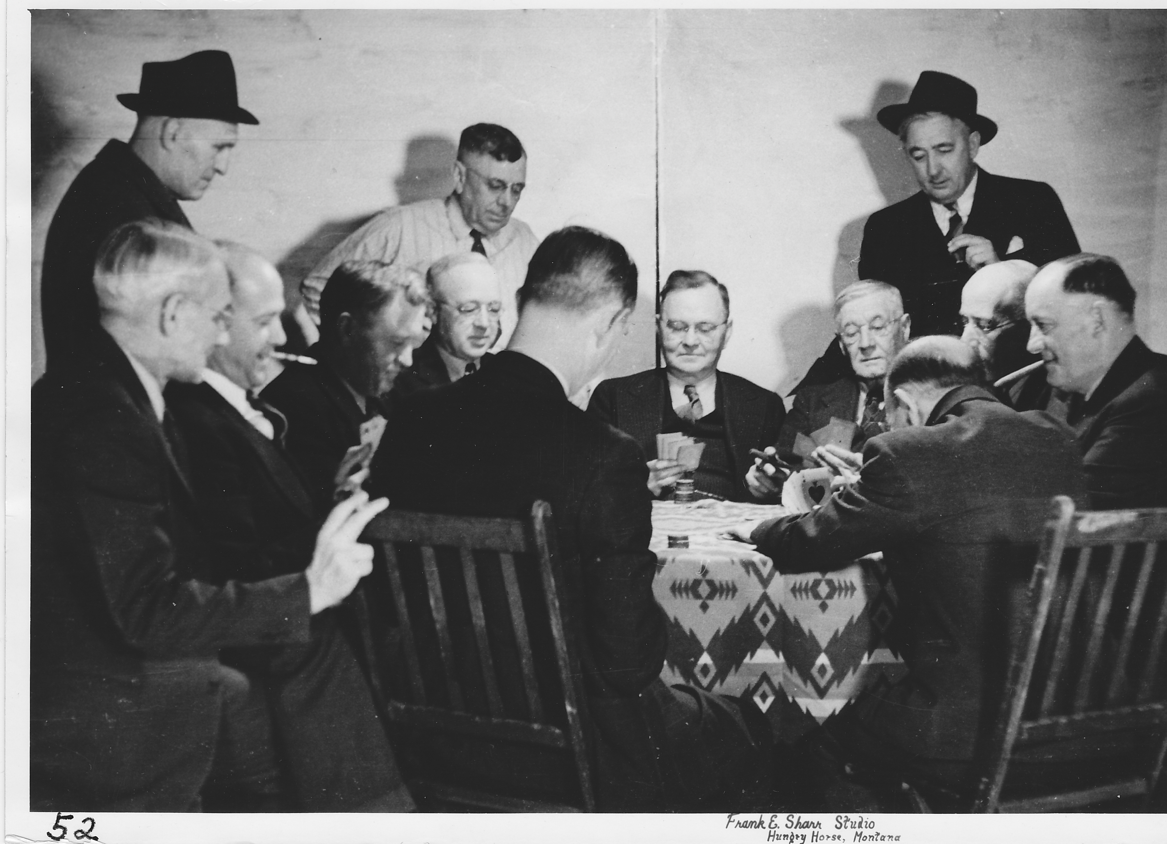 Poker Club. L-r clockwise. – Leon Knox, Marvin Clark, Clare Fauver (standing), Charles Figy, Elmer Bringman, Clyde Smith (standing), Dr. J. Monroe, Wm. Rorick, G. H. Gerlach (standing), Clarence Fellows, Martin Swaney, Sam Berlin, Robert Paine.