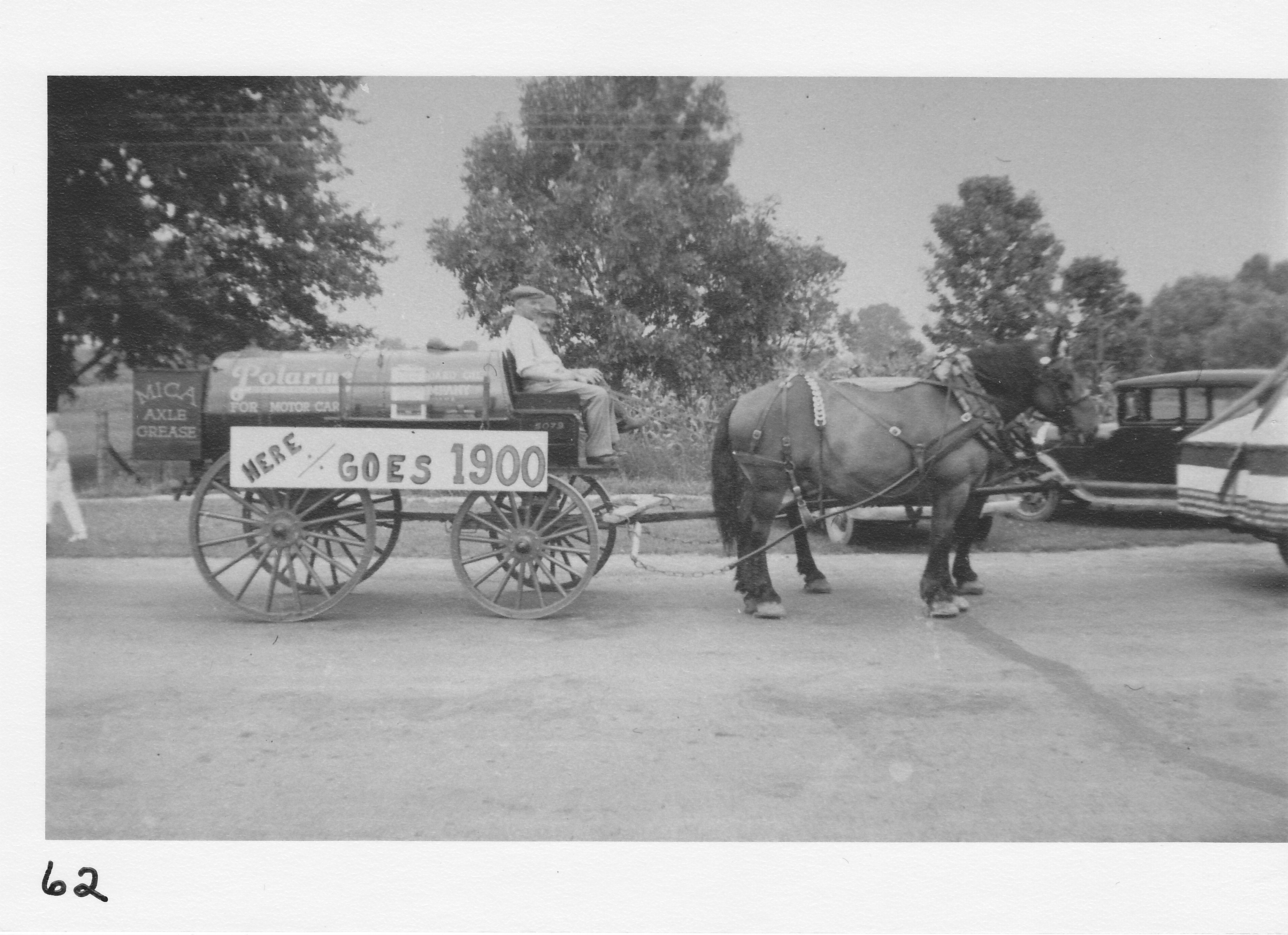 Standard Oil Co. in 1933 parade.  Pat Whaley owner and driver, George Sproull, Roscoe Mercer.  Year 1900 probably signifies beginning of Standard Products.