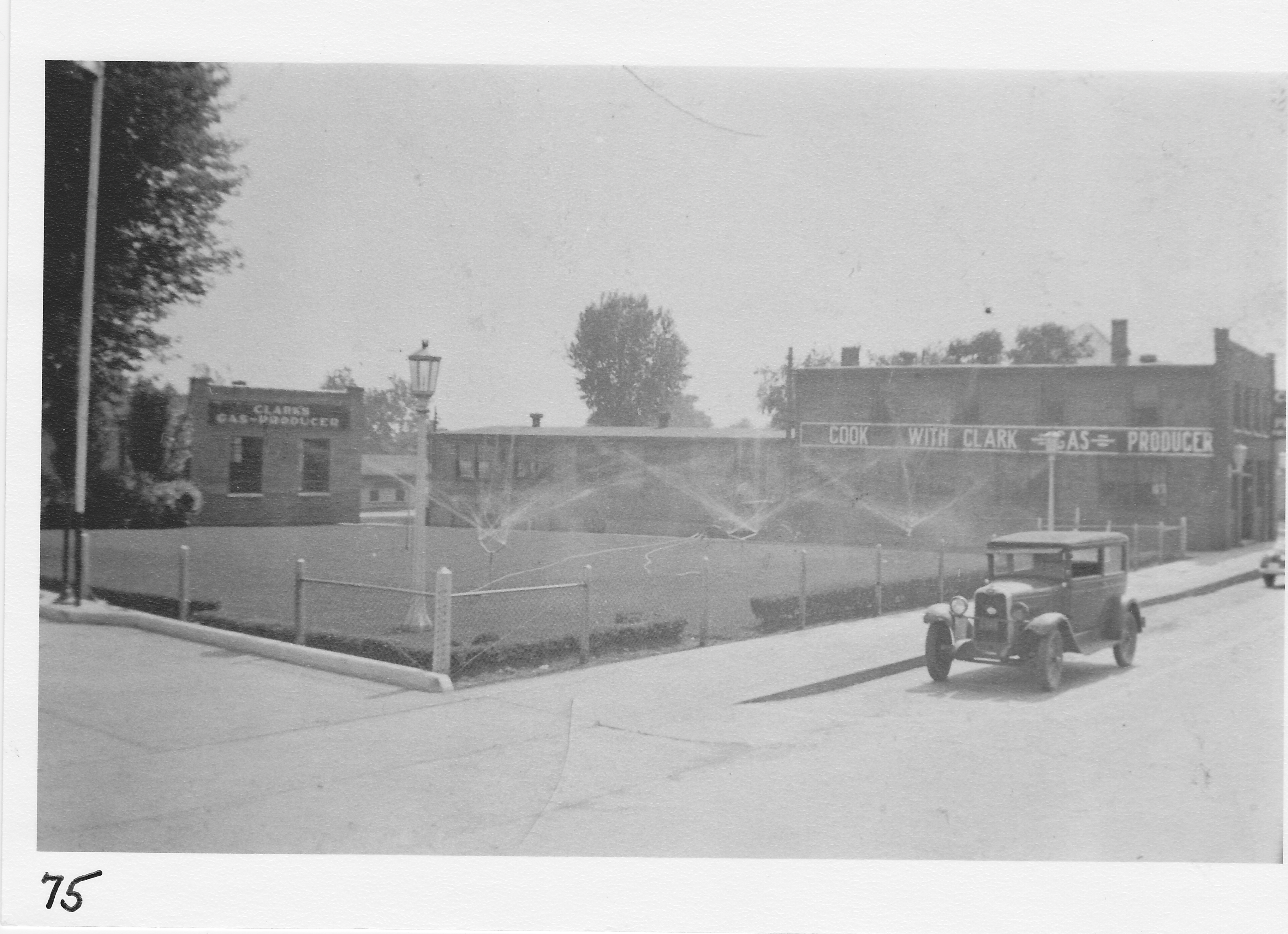 Clark’s Gas Company, south side West Main St., opposite former Mill St. entrance.