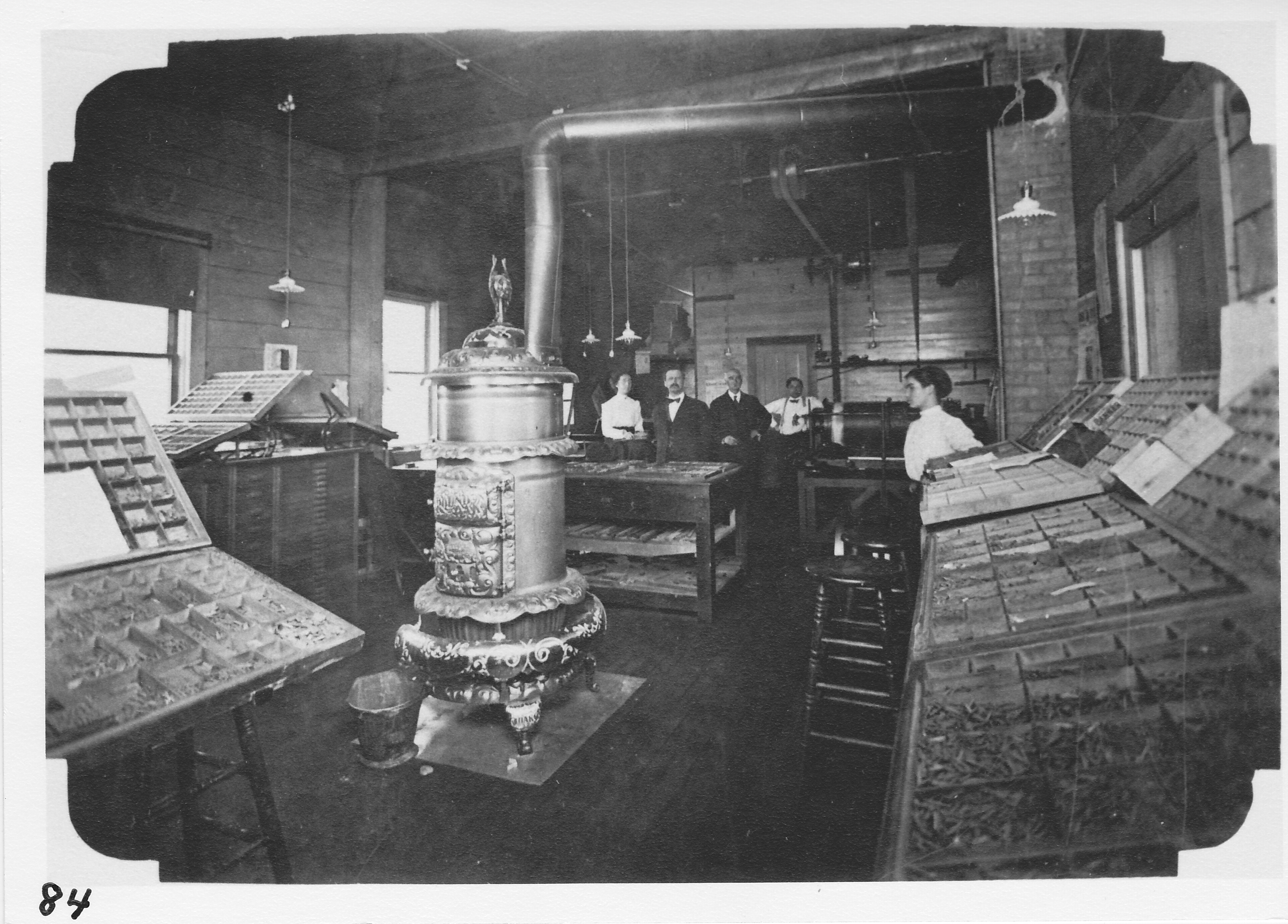 The Observer printing office on North Street.  A. E. Allen, owner, standing second from right in rear.