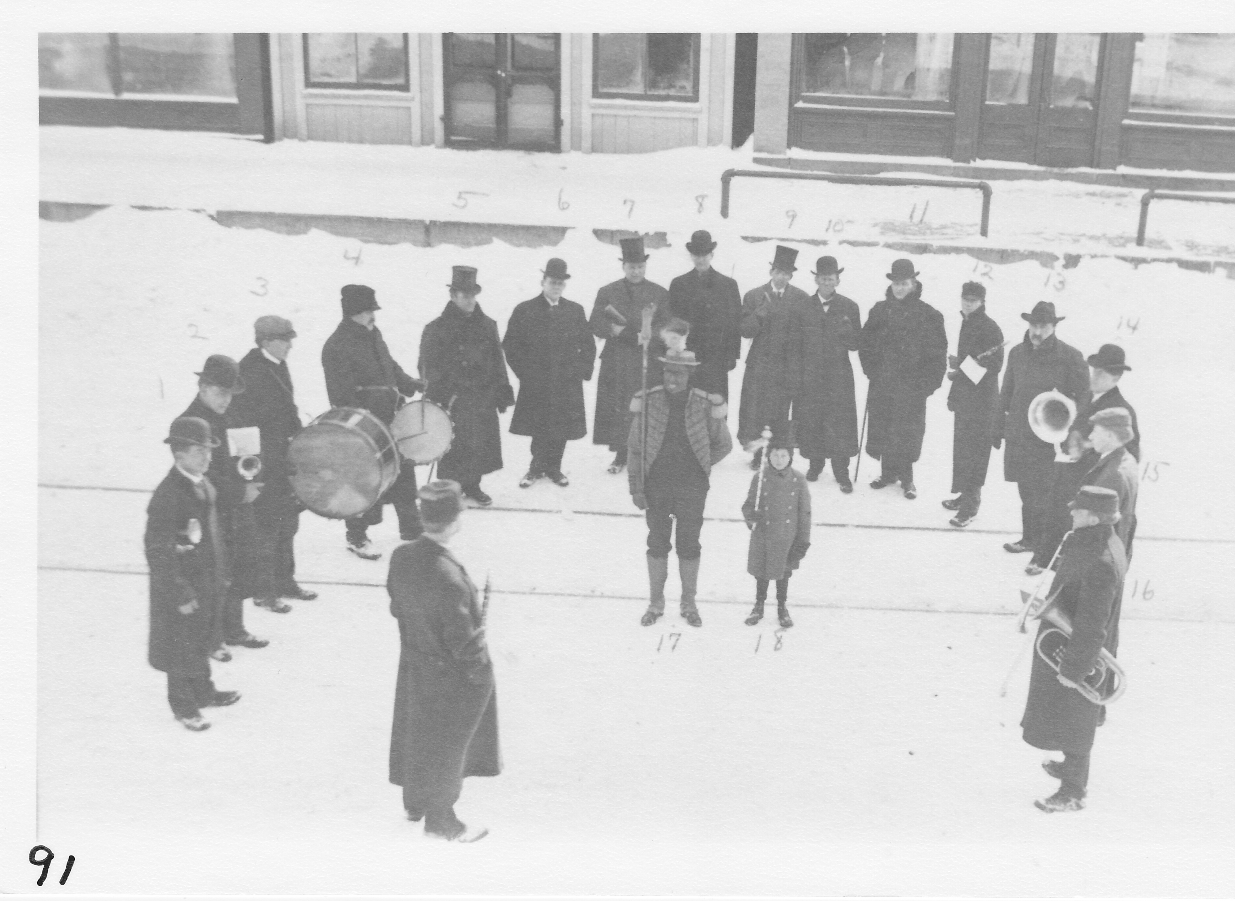 Morenci Band in 1901. South side of West Main St. in front of old Scofield Furniture Store.  Left to right: Harve Seigfried, Hervey Luke, Harry E. Allen, H. H. Spencer, Millard George, C. A. Wilson, Judge Burton Hart, ___________, Lou Reppert, Milton War, William Scofield, Frank Brower, Bert Beck, Bert Osgood, Clarence Brower, Luther Gay.  Center:  Charles Todd and Donald Crabbs (young boy).  Standing in front:  Jake Glime.