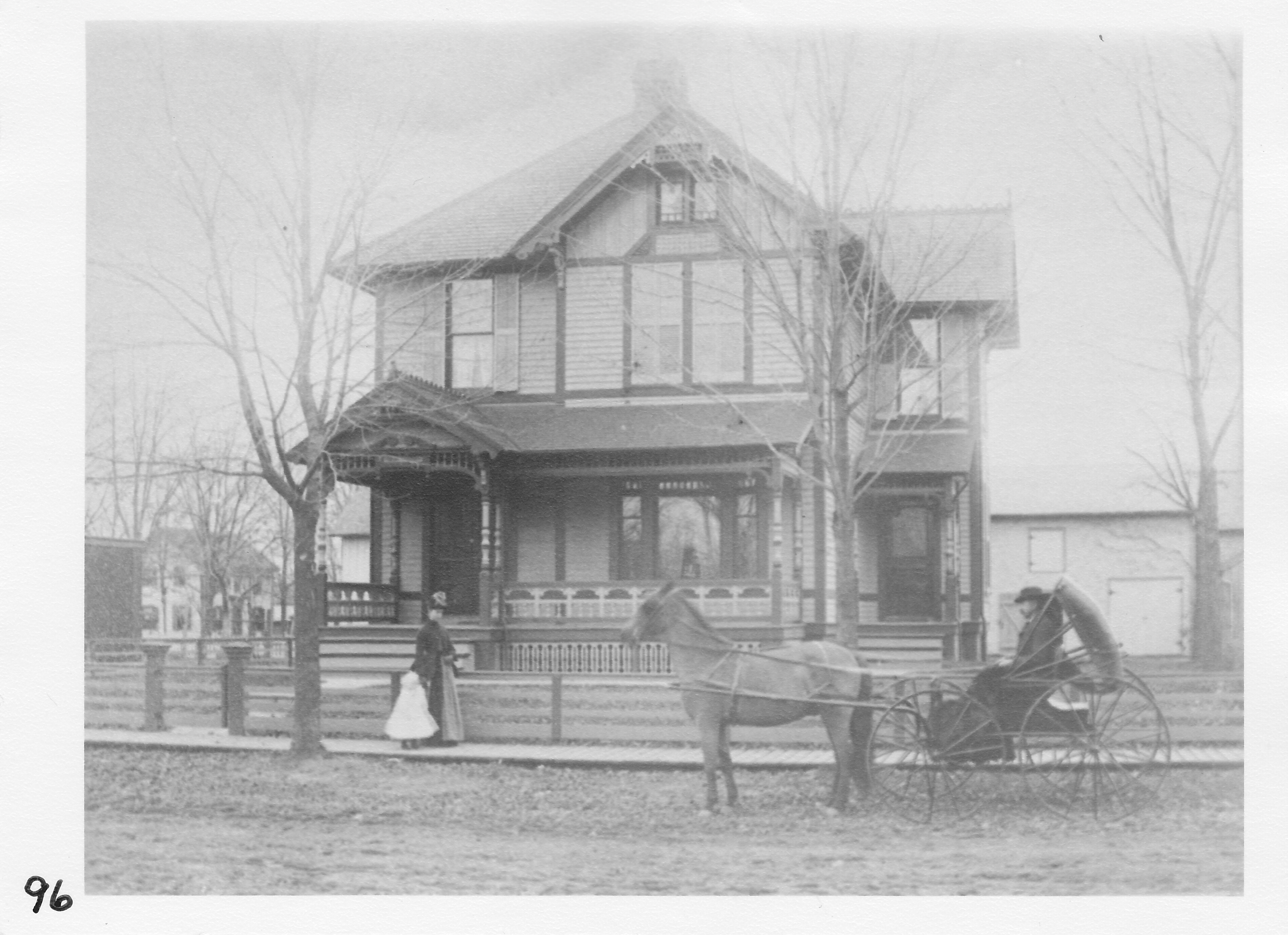 W. W. Crabbs residence at 120 N. Summit Street.  Mrs. Crabbs and daughter Hazel.  Mr. Crabbs in buggy.