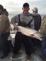 Former staff member holding large salmon