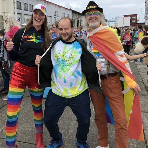 Three staff members enjoying the Astoria Pride festivities