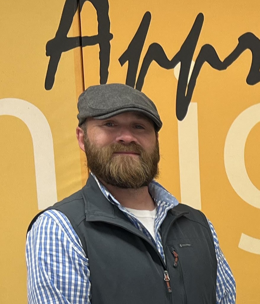 man in hat and polo shirt