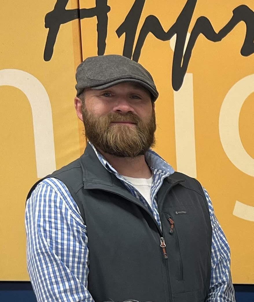 Woman in pink cardigan