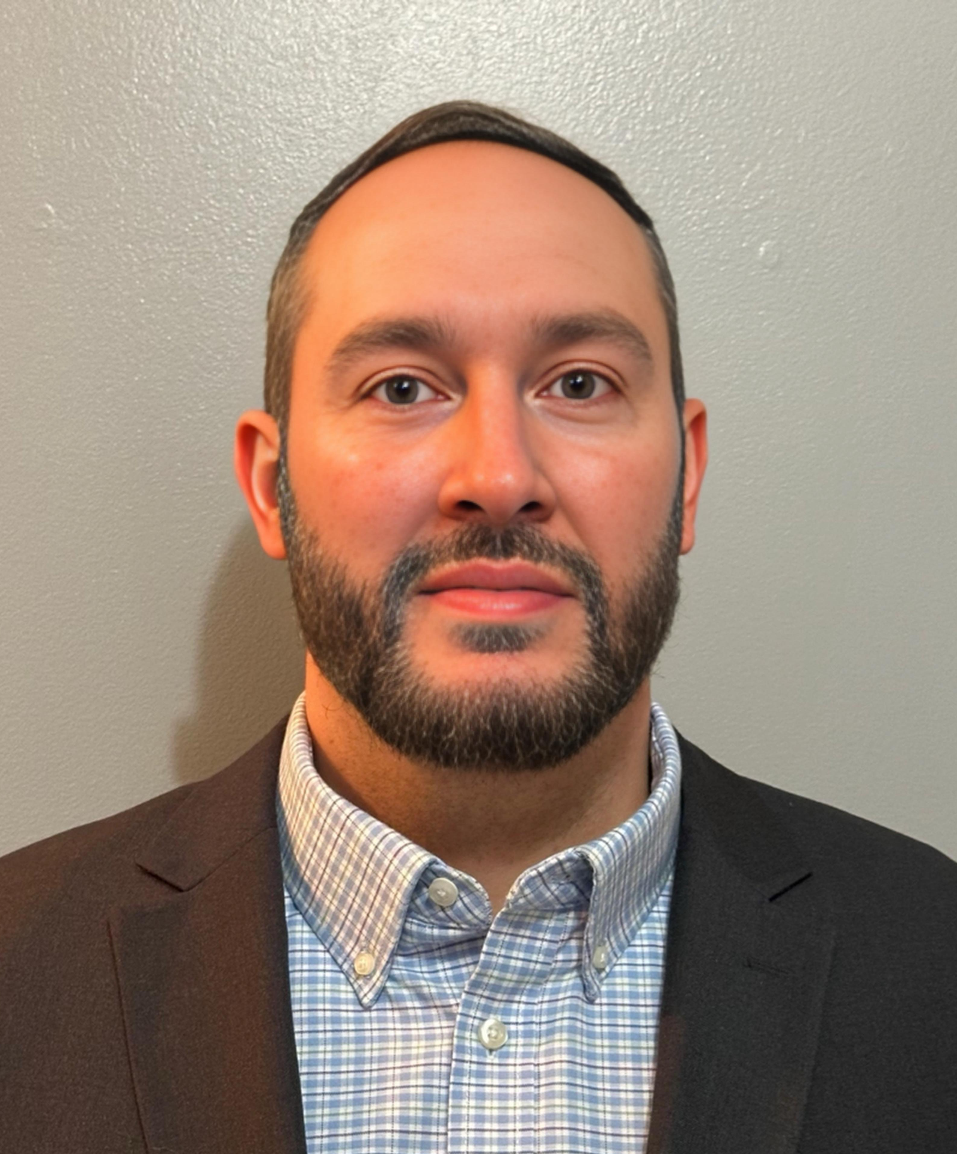 man in hat and polo shirt