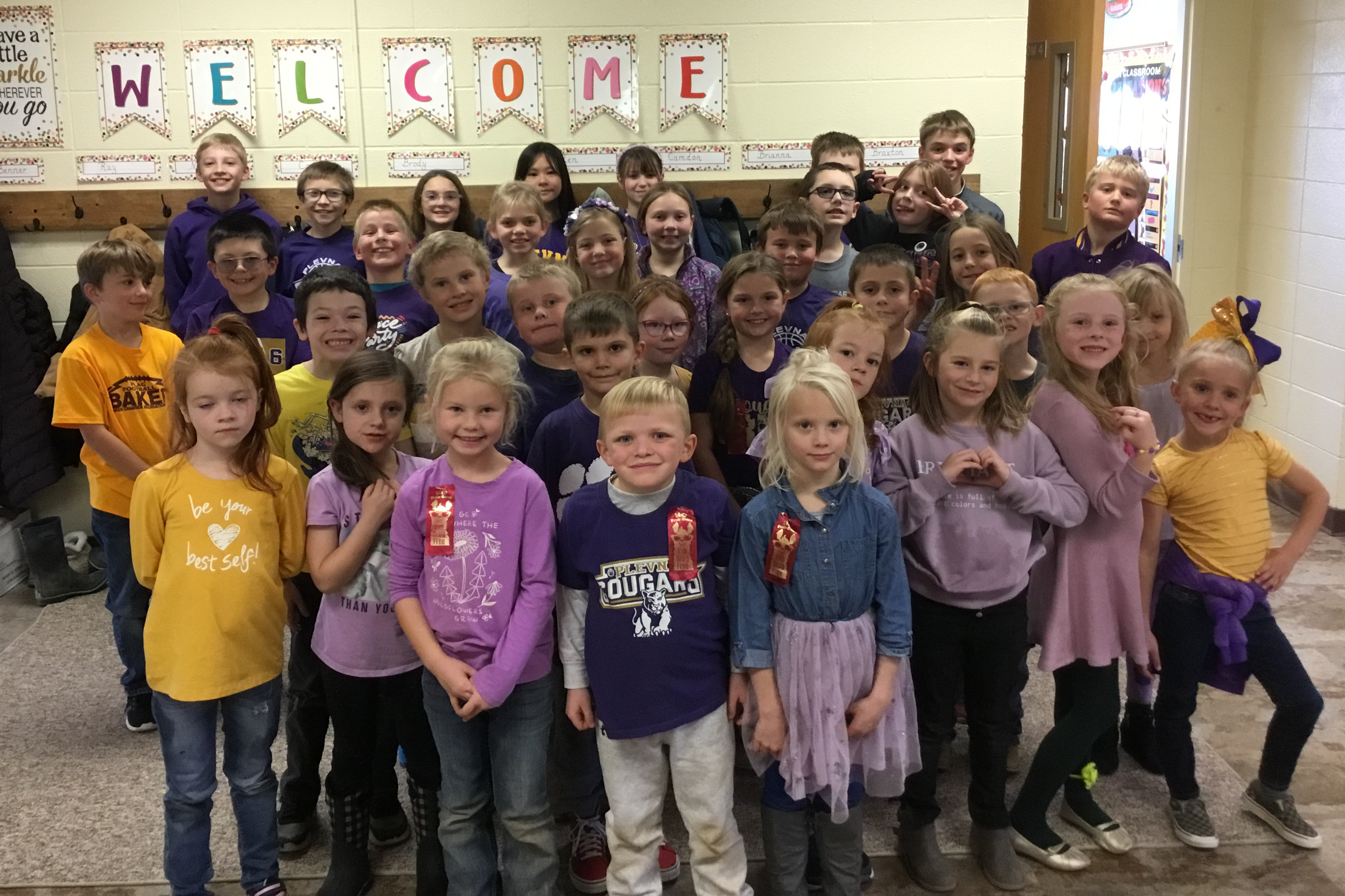 Elementary group photo of students in school colors.