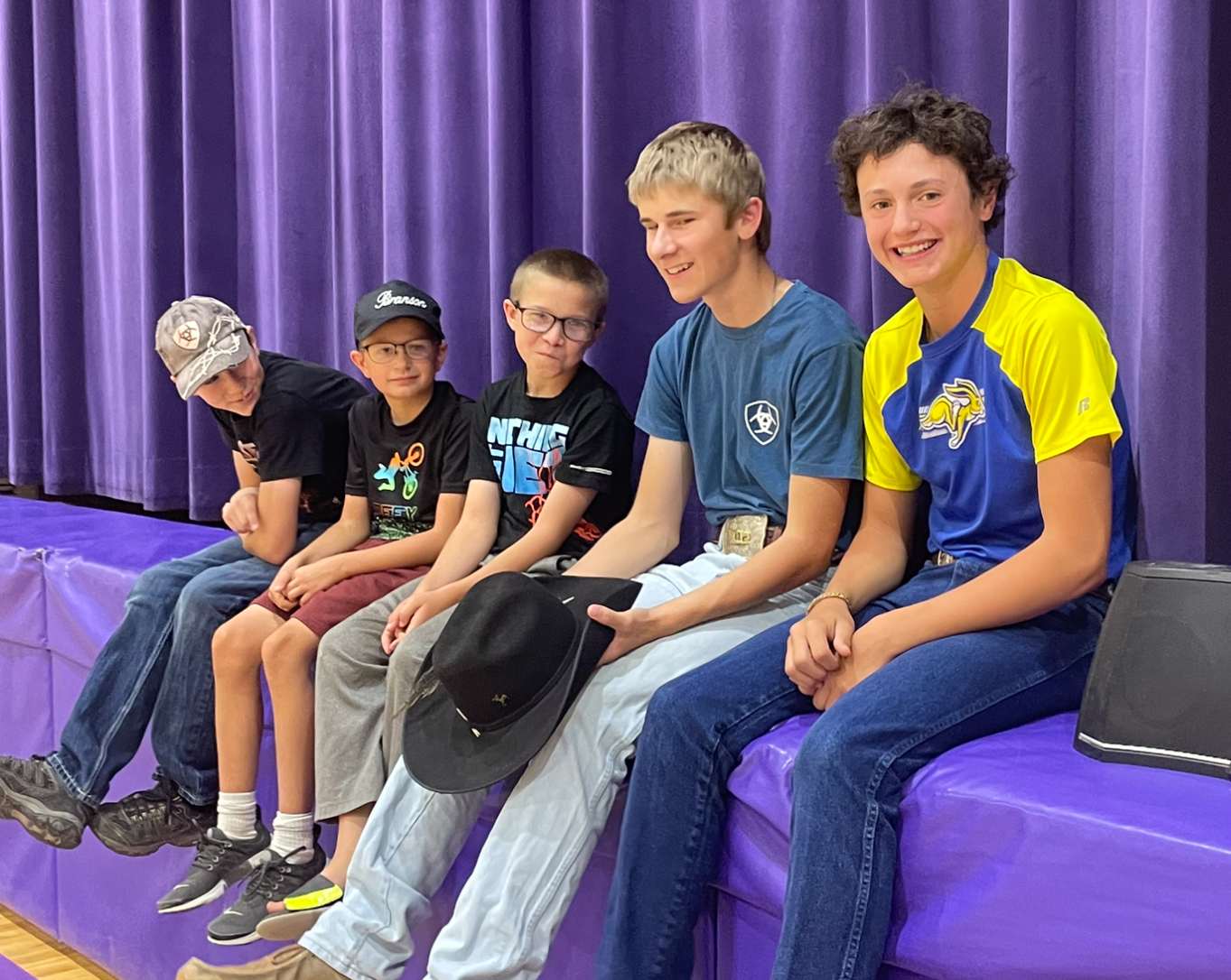 JH Students sitting on the stage.