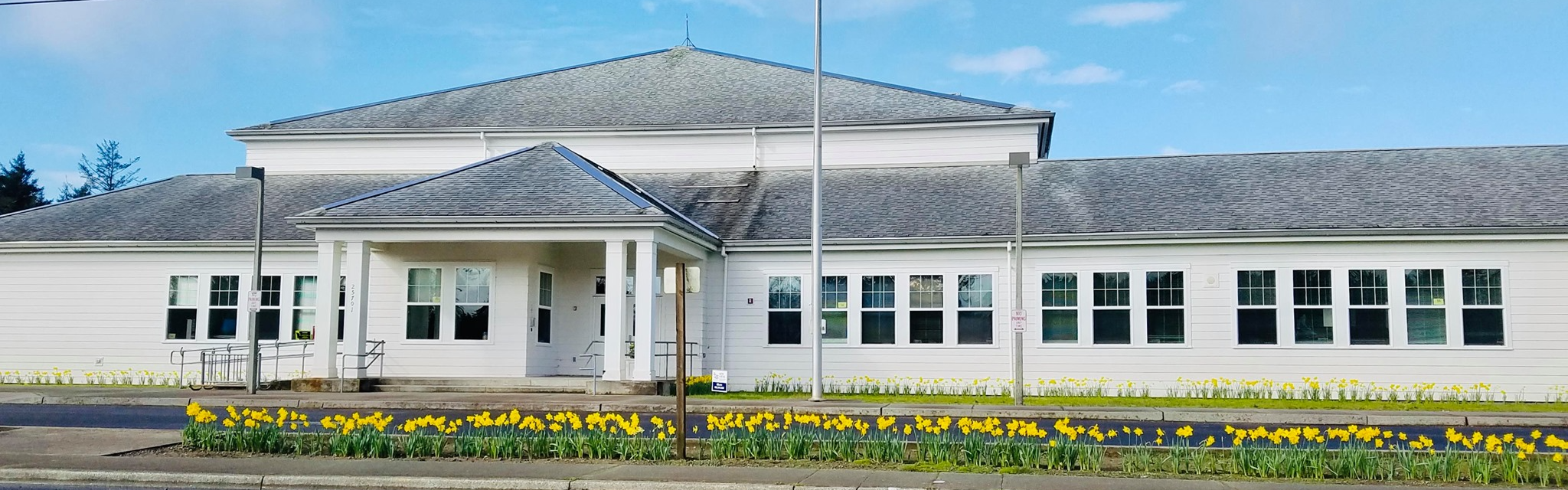 Front of School with Daffodils Blooming