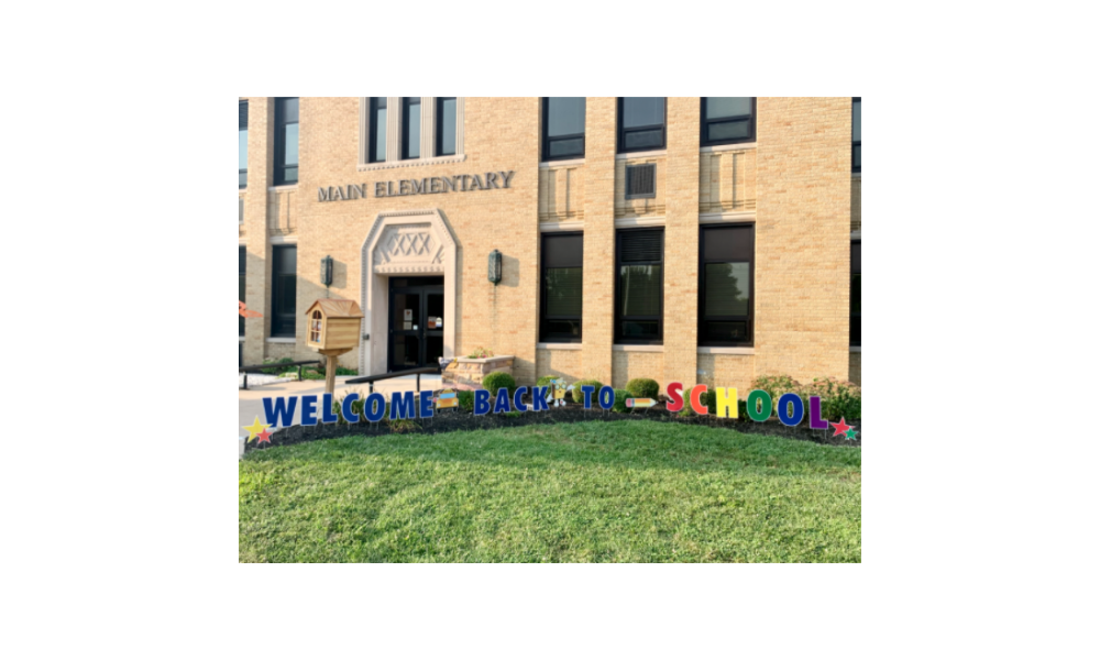 Main Elementary Campus with sign reading "Welcome Back to School!"