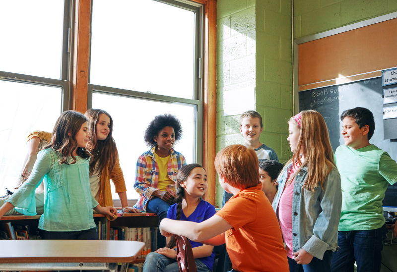 Students standing in a classroom