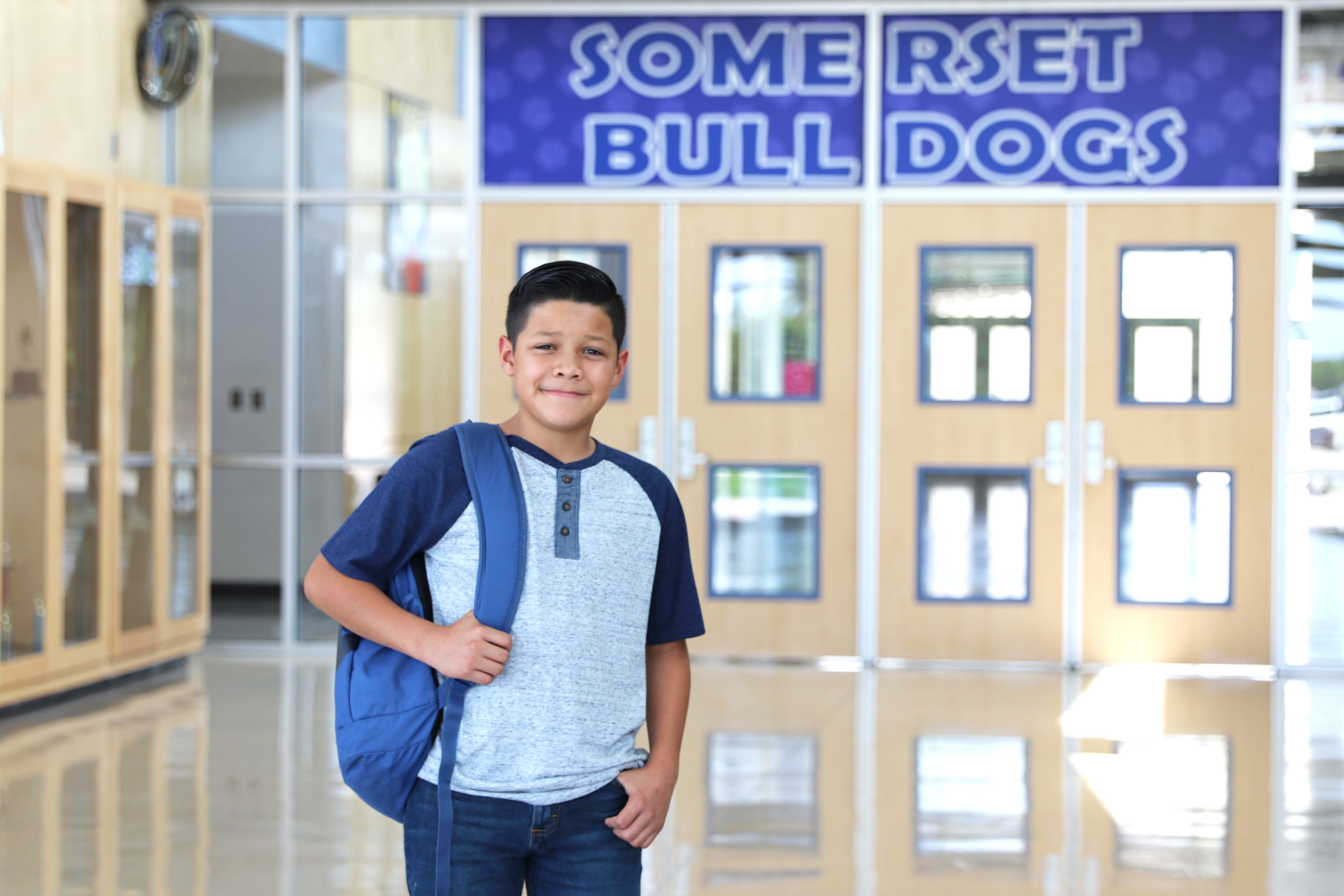 SJH Student holding backpack