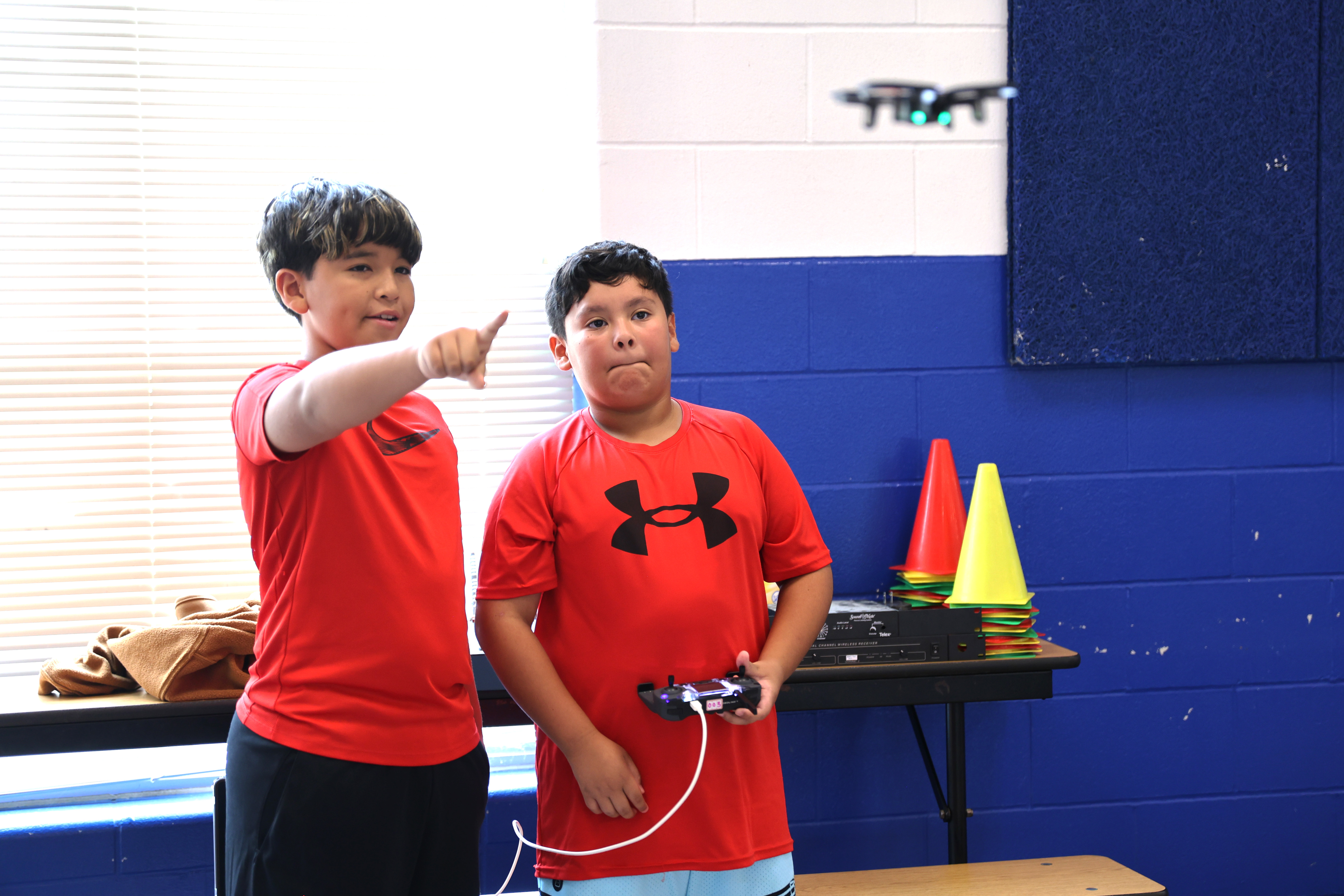 students flying drone
