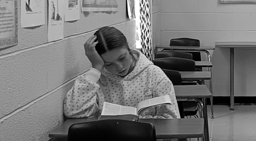 student reading the Bible