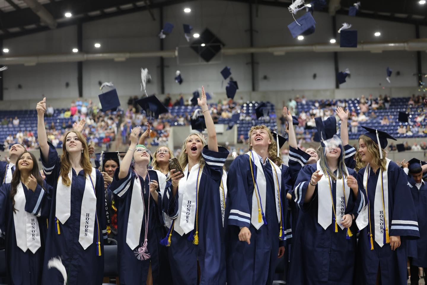 EHS Graduation Class of 2026 throw their caps in the air