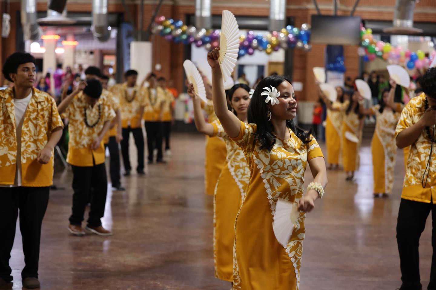 Marshallese student dancing a cultural dance at Islander Night.