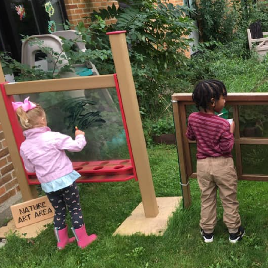 children painting in courtyard